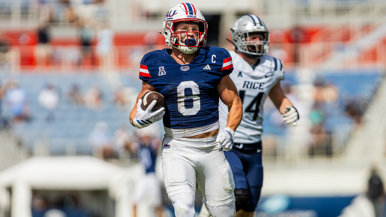 FAU receiver Easton Messer (8) runs with the ball ahead of a Rice defender during the Owls' 51-49 win over Rice at Flagler Credit Union Stadium in Boca Raton on October 24, 2026.