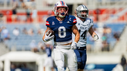 FAU receiver Easton Messer (8) runs with the ball ahead of a Rice defender during the Owls' 51-49 win over Rice at Flagler Credit Union Stadium in Boca Raton on October 24, 2026.