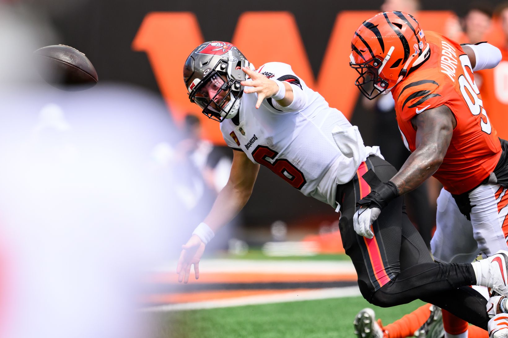 Cincinnati Bengals defensive end Myles Murphy hits Tampa Bay Buccaneers quarterback Baker Mayfield (6) as the ball flies out of Mayfield's hand at Paycor Stadium.