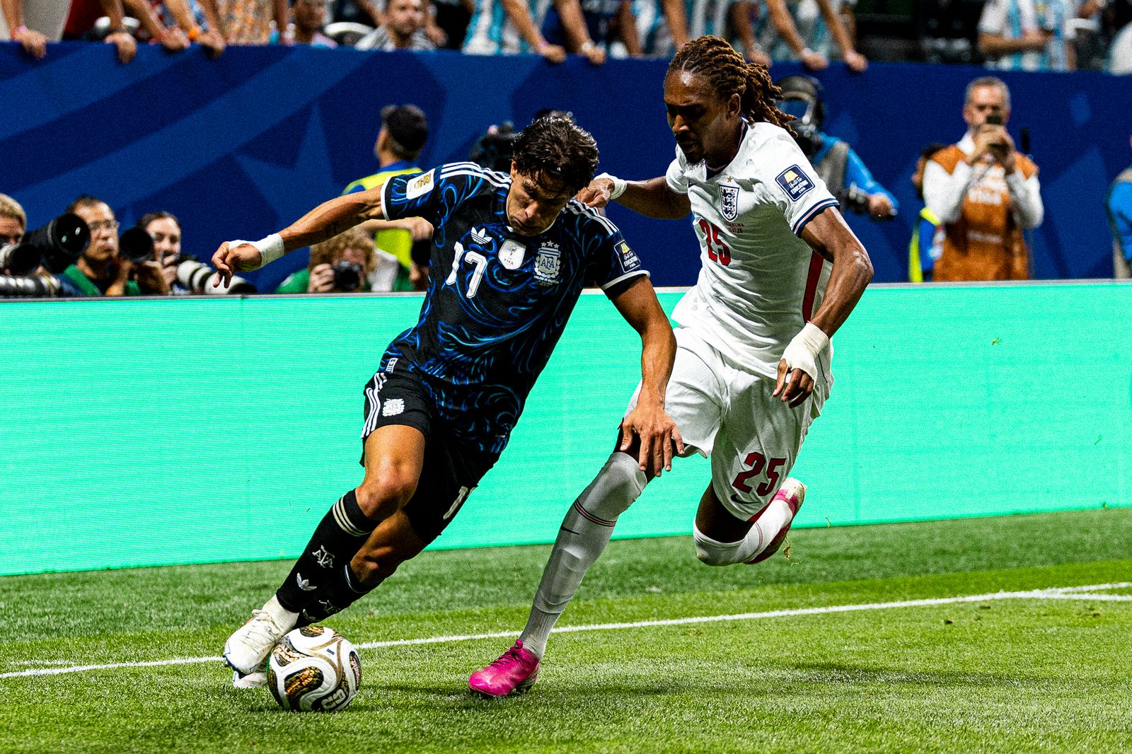 Argentina's Lionel Messi and England's Jude Bellingham, both wearing No. 10, battle for the ball during the World Cup semifinal on July 15, 2026 at Mercedes-Benz Stadium in Atlanta.