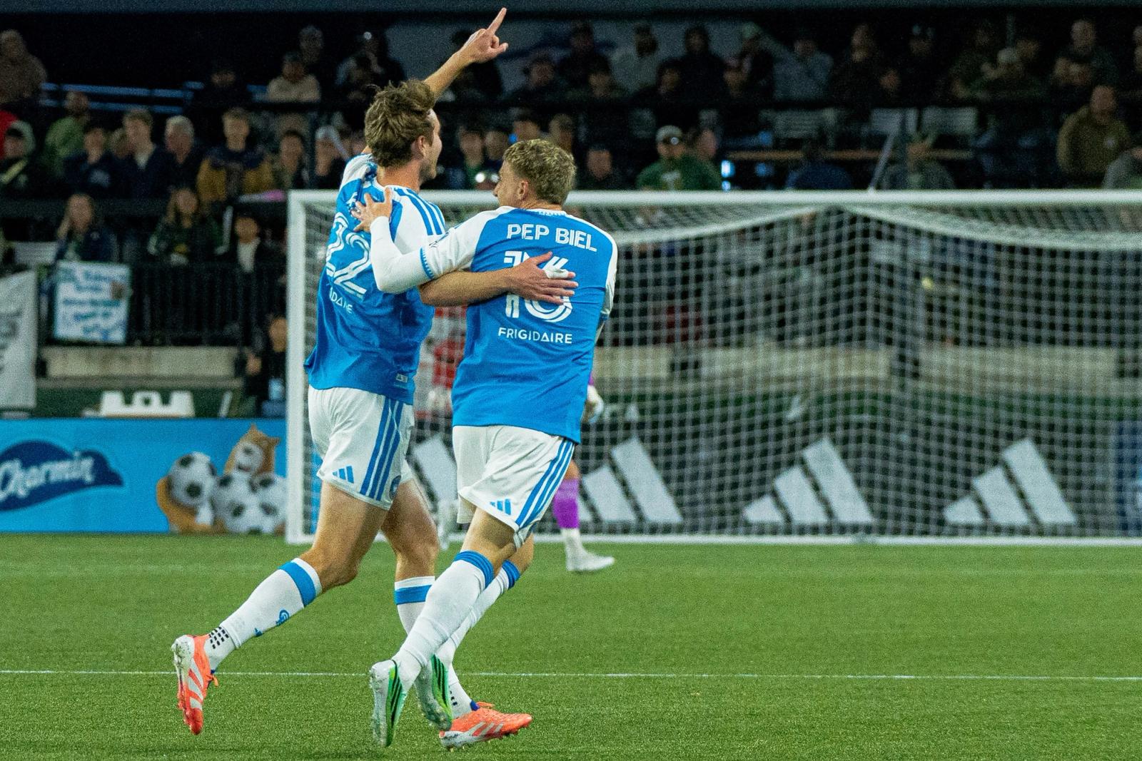Charlotte FC players celebrate a goal in front of the Portland Timbers net at Providence Park on October 24, 2026.