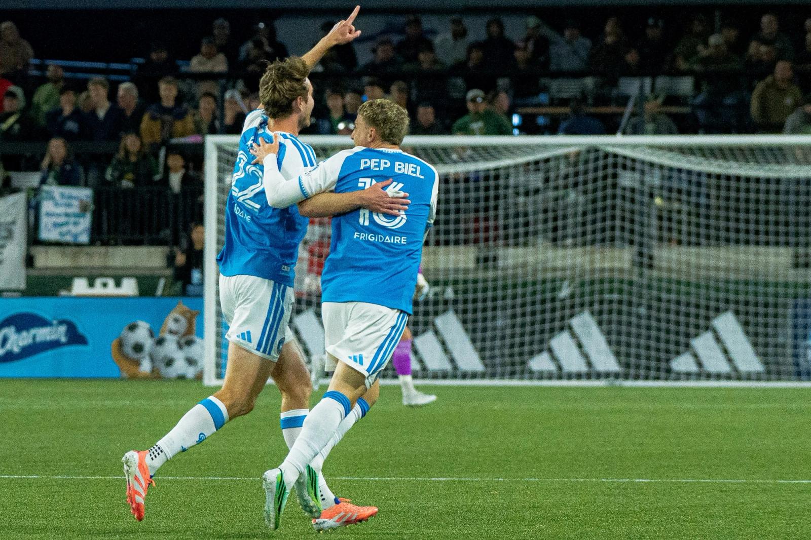 Charlotte FC players celebrate a goal in front of the Portland Timbers net at Providence Park on October 24, 2026.