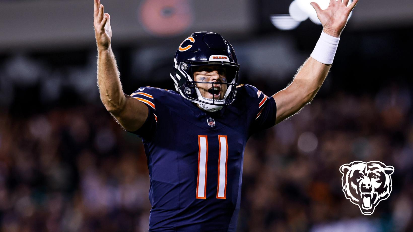 Chicago Bears quarterback Case Keenum (11) raises both arms in celebration during the Monday night game at Soldier Field.