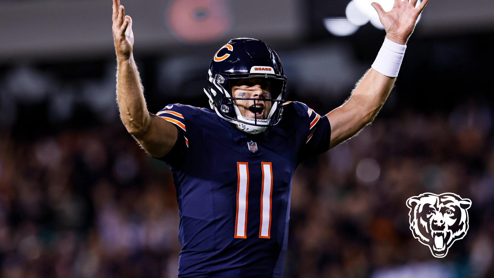 Chicago Bears quarterback Case Keenum (11) raises both arms in celebration during the Monday night game at Soldier Field.