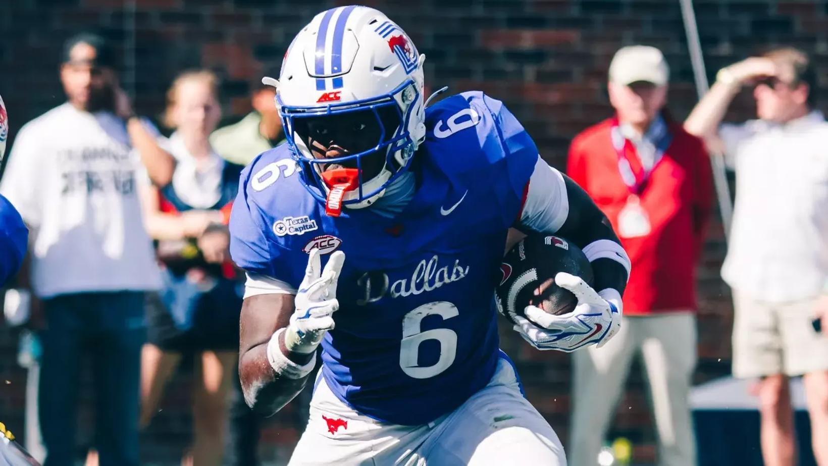 SMU running back Kendrick Raphael (6) carries the ball in a blue Dallas jersey during SMU's 59-20 win over California at Gerald J. Ford Stadium on Oct. 24, 2026