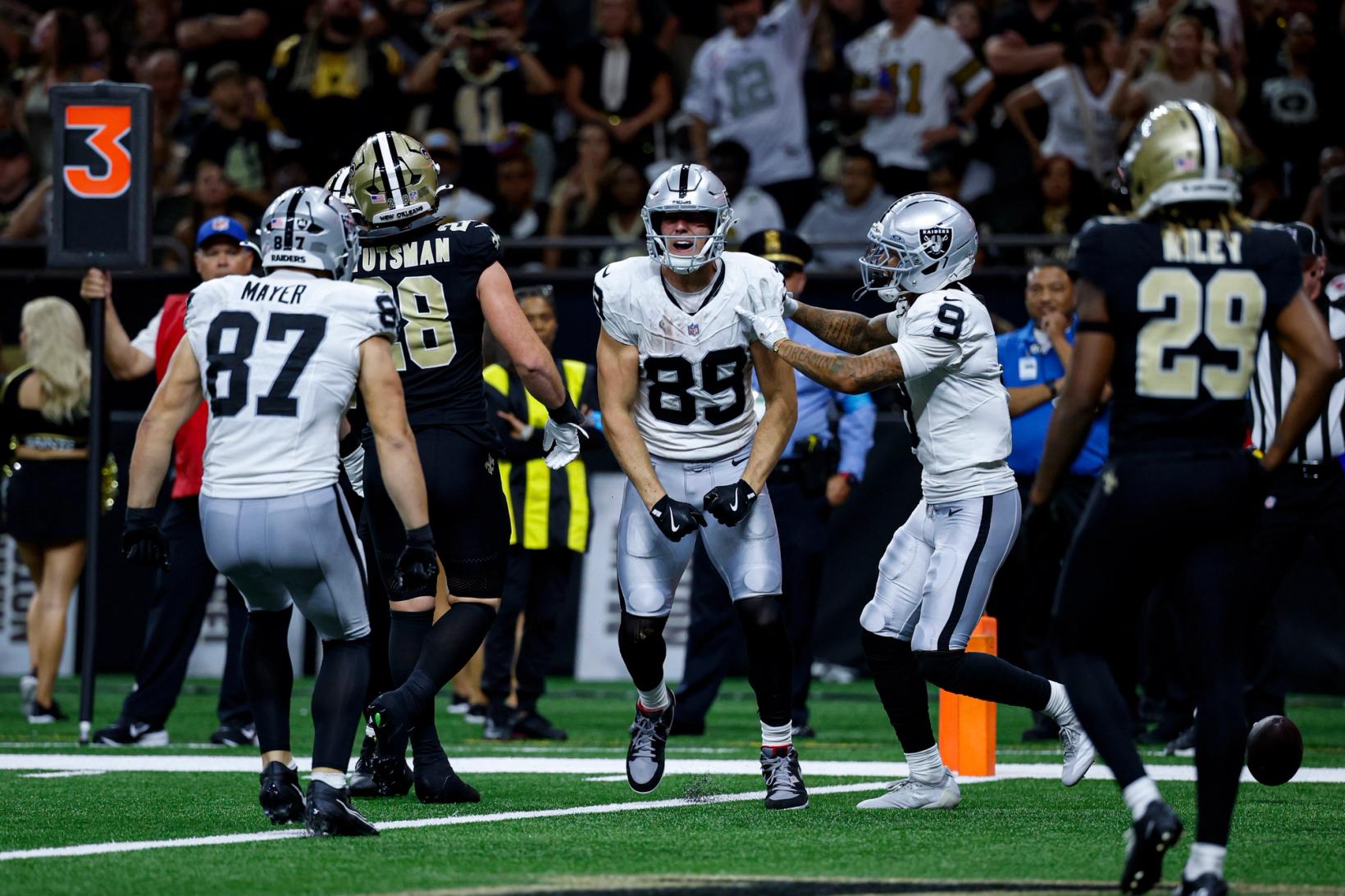 Las Vegas Raiders tight end Brock Bowers (89) celebrates with wide receiver Jalen Nailor (9) and tight end Michael Mayer (87) near the end zone at Caesars Superdome.