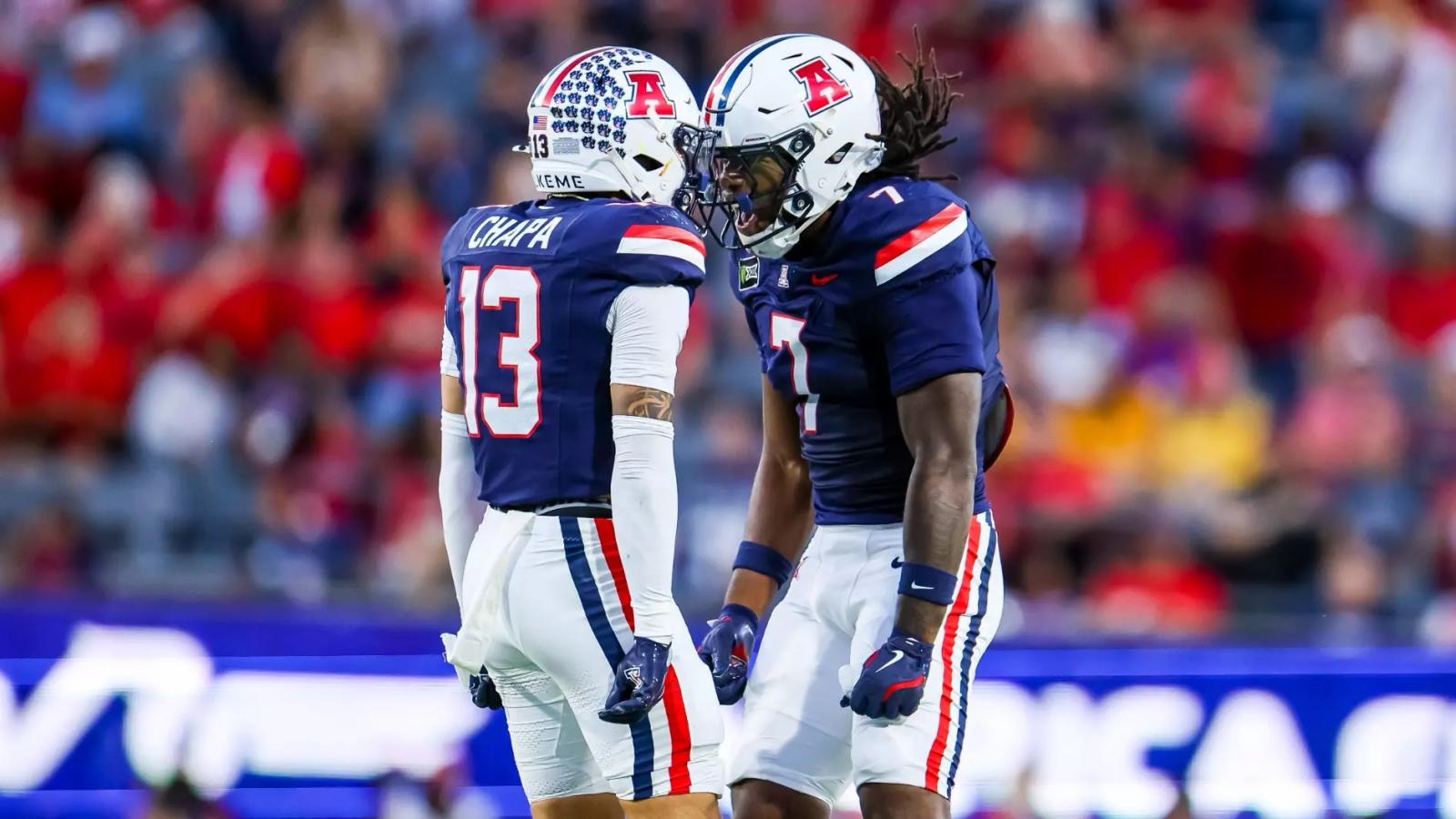 Arizona defenders Cam Chapa (13) and Chase Kennedy (7) celebrate a play during the No. 25 Wildcats' 39-3 win over Iowa State at Casino Del Sol Stadium in Tucson on October 24, 2026.