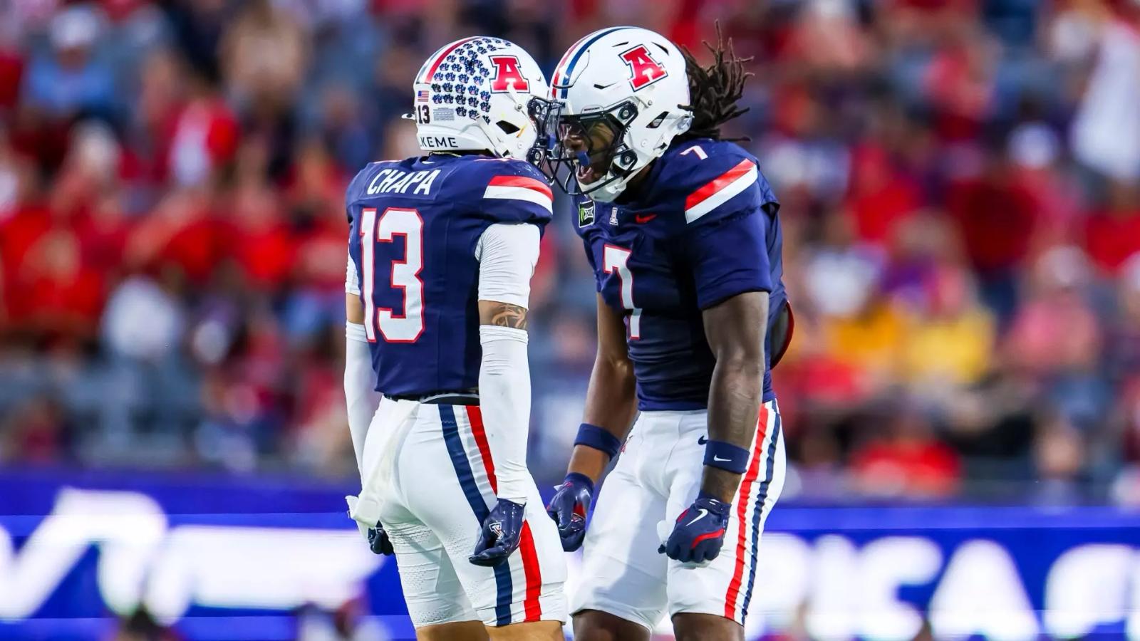 Arizona defenders Cam Chapa (13) and Chase Kennedy (7) celebrate a play during the No. 25 Wildcats' 39-3 win over Iowa State at Casino Del Sol Stadium in Tucson on October 24, 2026.
