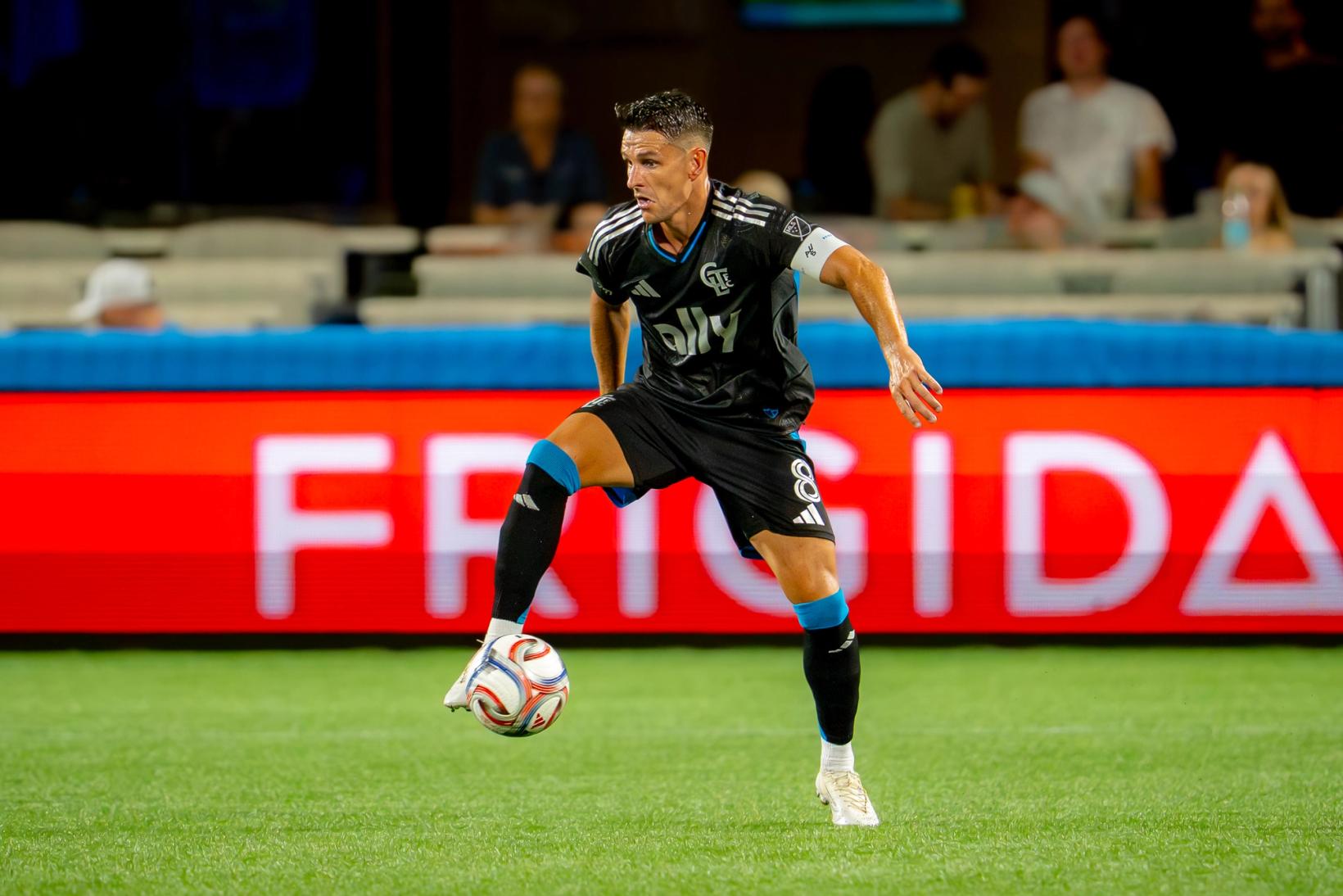 Charlotte FC captain Ashley Westwood on the ball against Houston Dynamo at Bank of America Stadium. Photo Credit: Arturo Rosales Sevilla/Undrafted