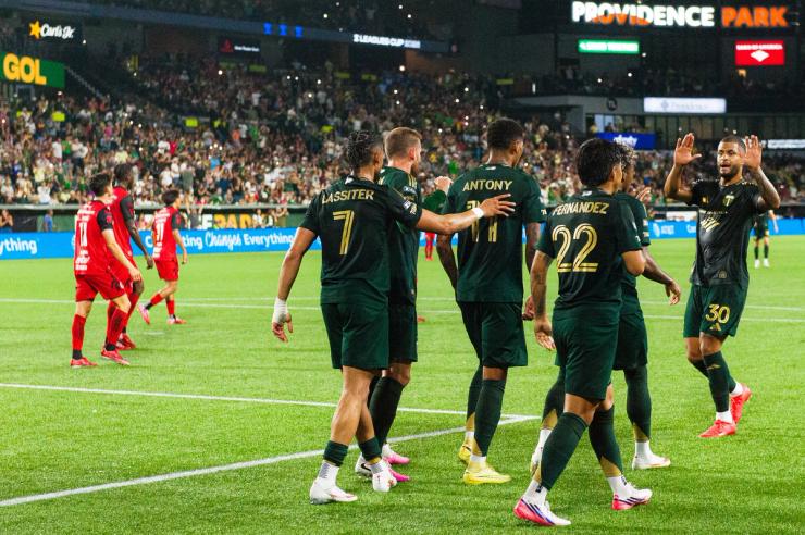 Portland Timbers players including Ariel Lassiter and Antony celebrate a goal against Club Tijuana during the August 13, 2026 Leagues Cup match at Providence Park.