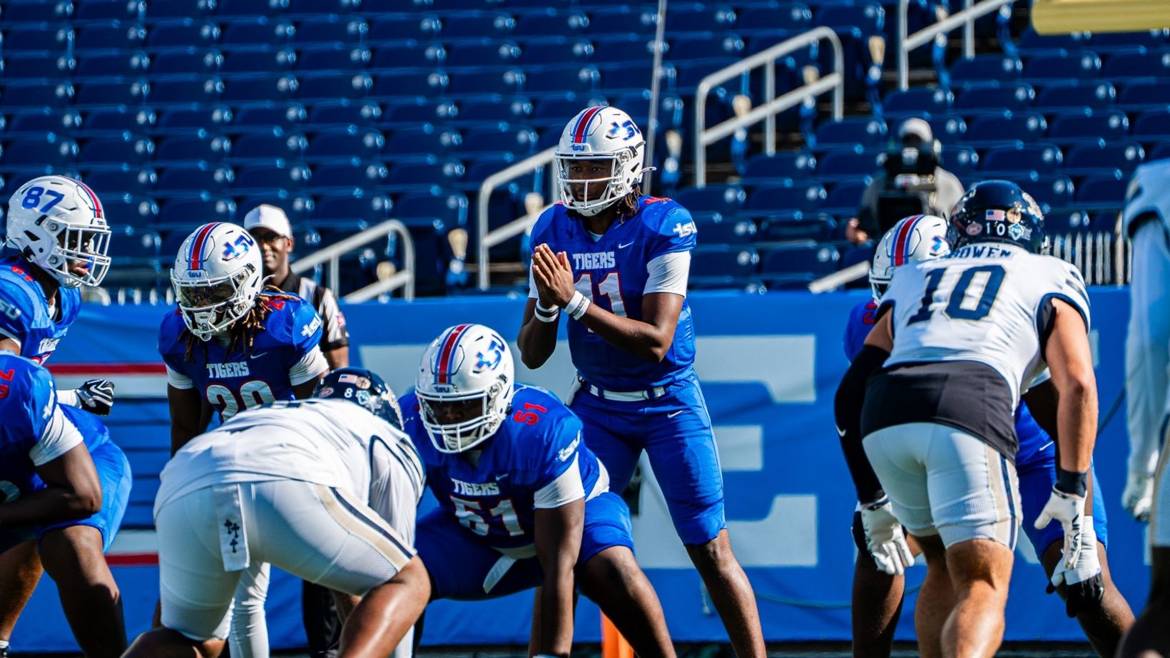 Tennessee State quarterback No. 11 under center as Charleston Southern defenders in white line up across from the Tigers at Nissan Stadium, Oct. 24, 2026
