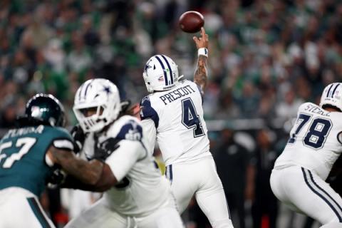 Dallas Cowboys quarterback Dak Prescott (4) releases a pass as his linemen, including No. 78, block a Philadelphia Eagles pass rusher.