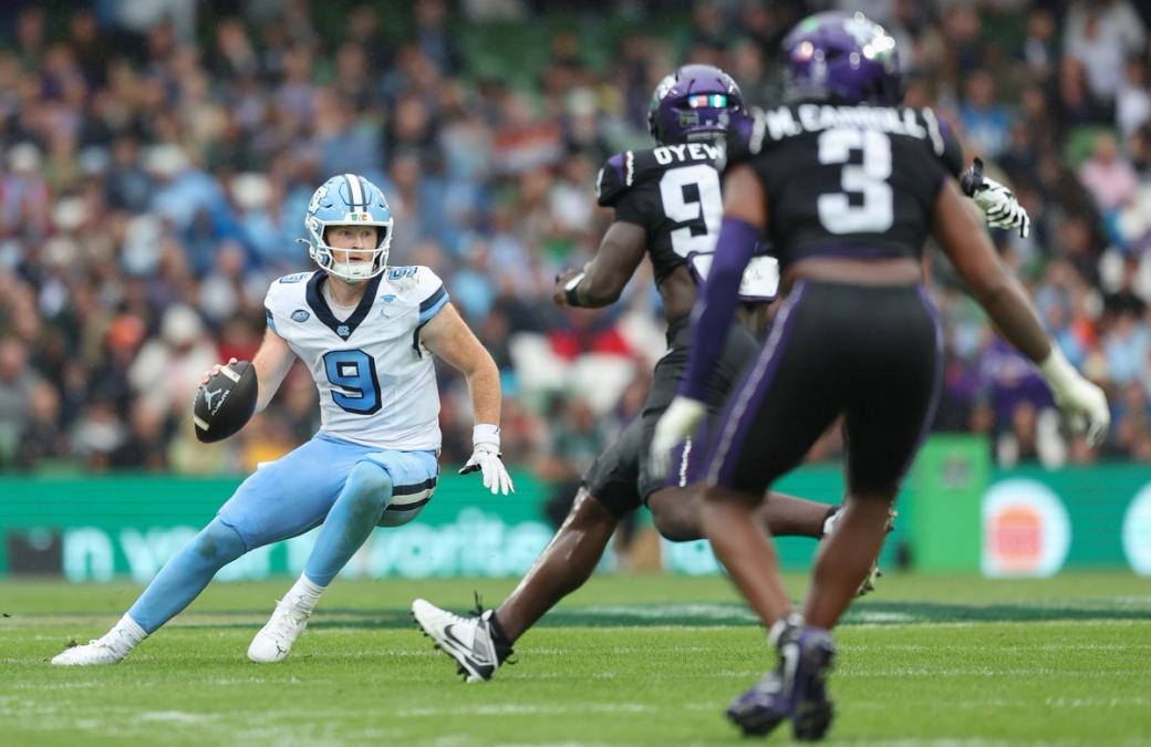 UNC quarterback Billy Edwards Jr. scrambles against TCU at Aviva Stadium in Dublin