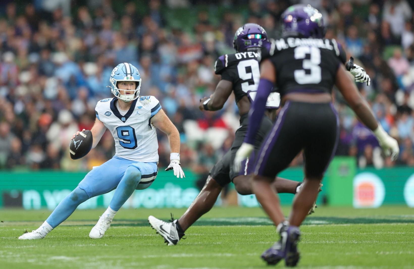 UNC quarterback Billy Edwards Jr. scrambles against TCU at Aviva Stadium in Dublin