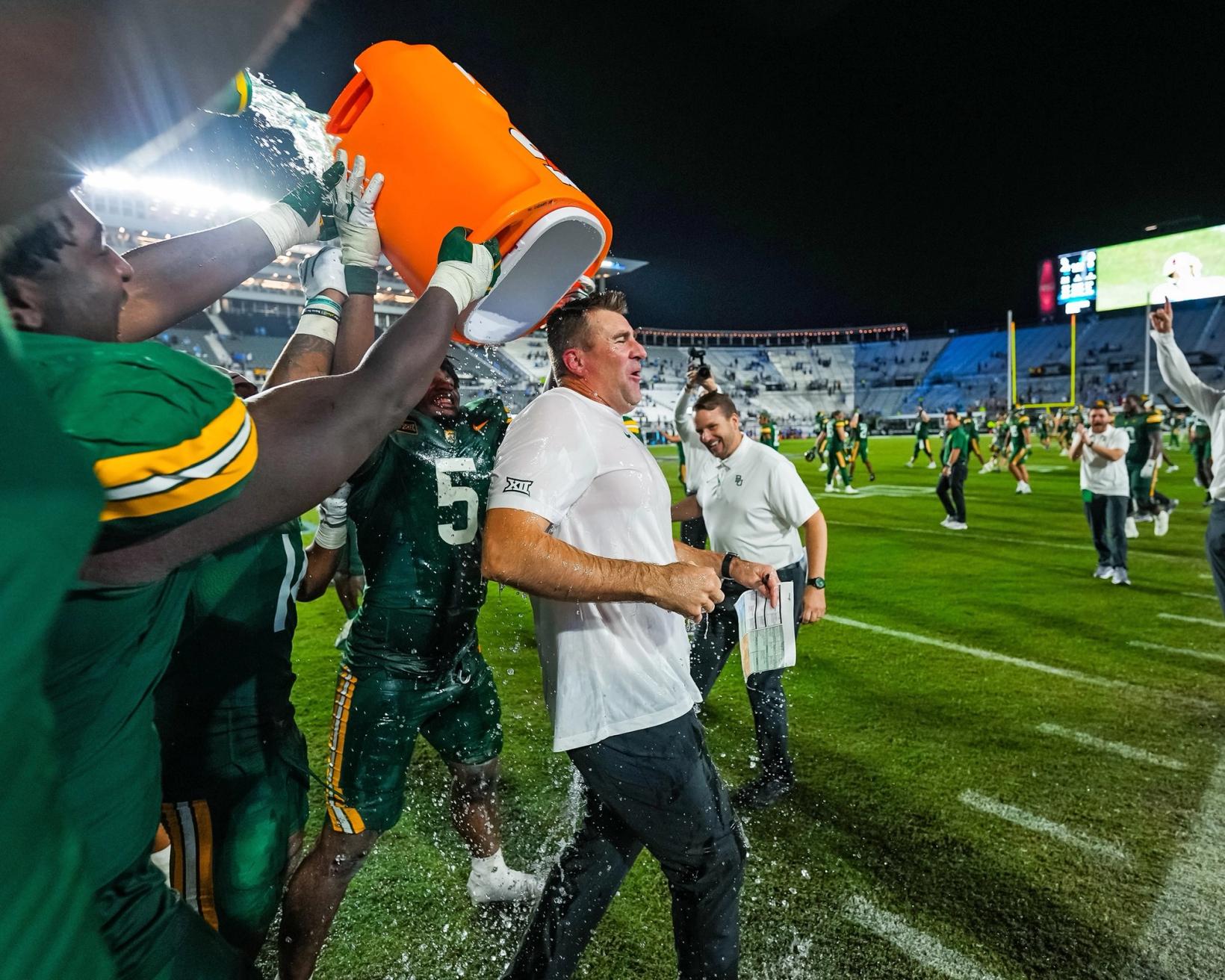 Baylor players douse interim head coach Joe Klanderman after the Bears' 41-9 win over UCF on Oct. 30, 2026, at the Acrisure Bounce House in Orlando