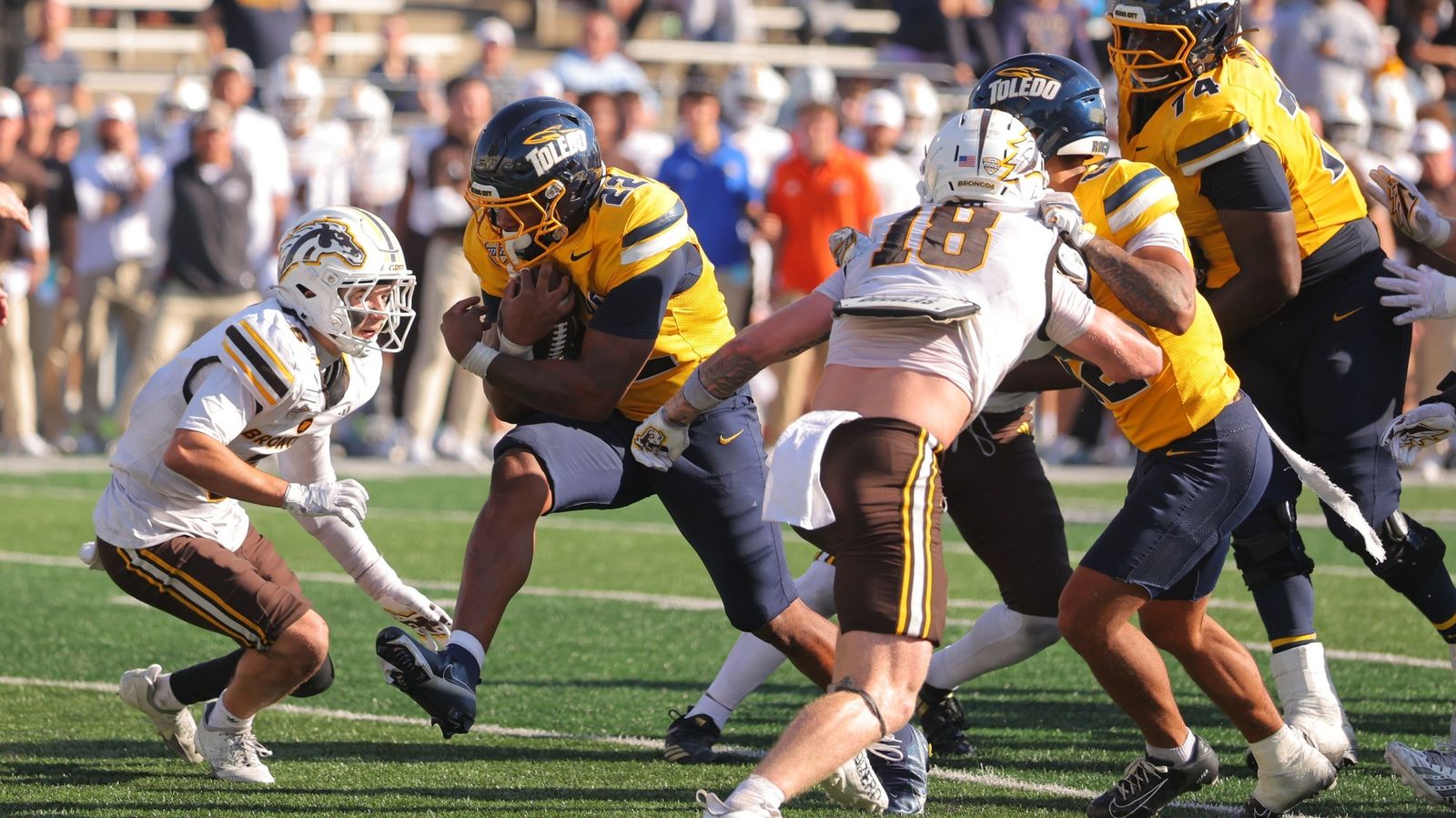 Toledo running back CJ Miller carries the ball against Western Michigan at the Glass Bowl