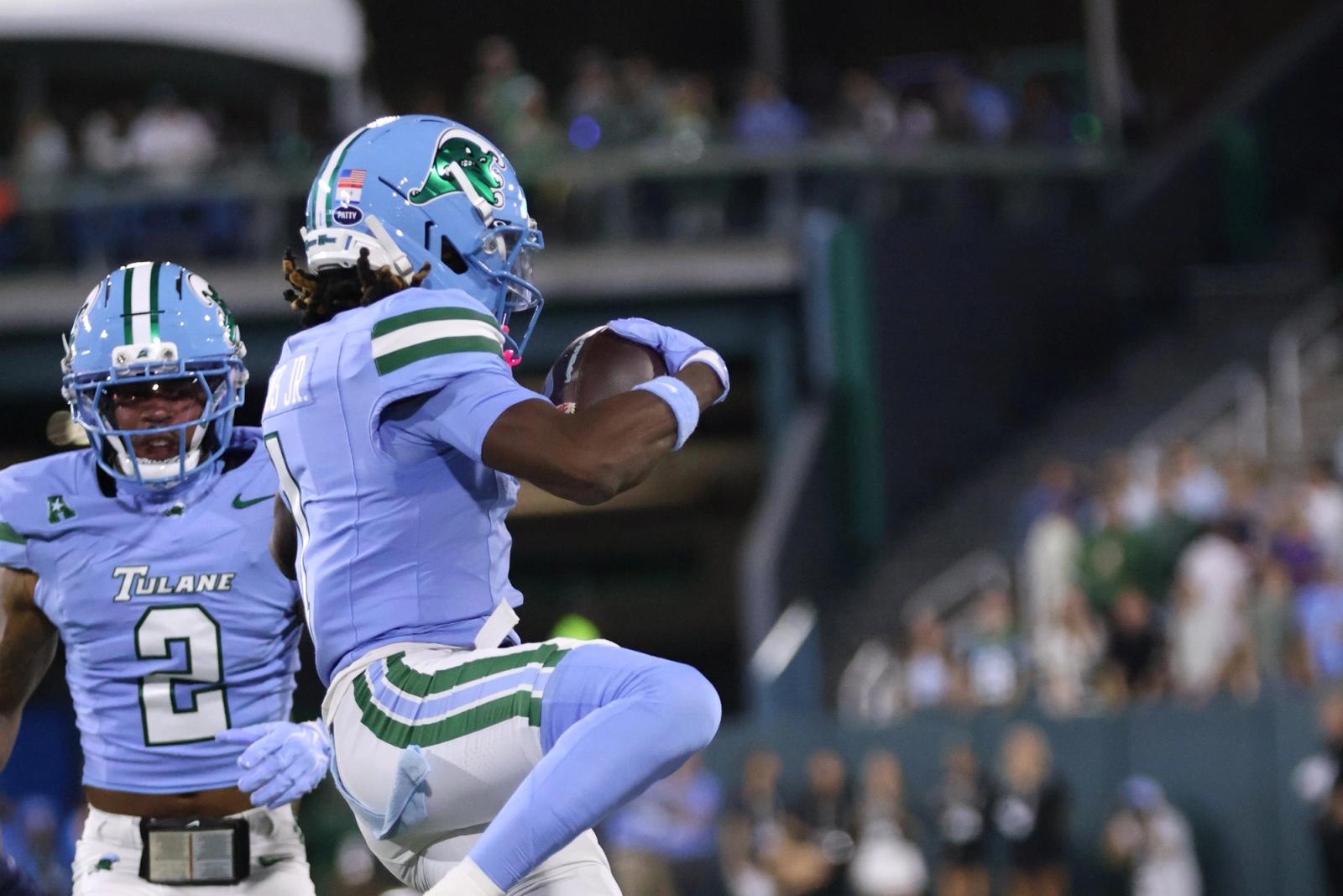 A Tulane player secures the football beside a teammate during the Green Wave's game against UTSA at Yulman Stadium on October 24, 2026.