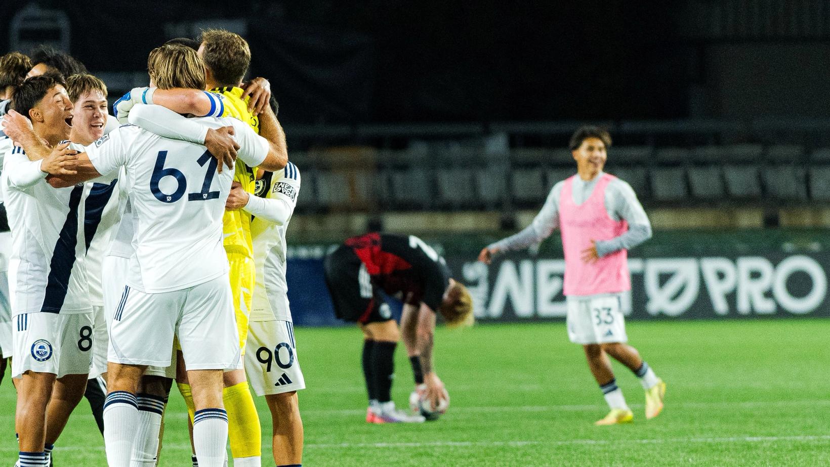 Ventura County FC players in white embrace in celebration at Providence Park during the MLS NEXT Pro Western Conference Semifinal against Portland Timbers2 on October 25, 2026.