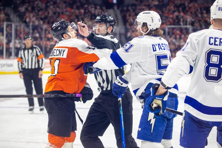 The Flyers' Nikita Grebenkin and the Lightning's Max Crozier drop the gloves during the January 12, 2026 game at Xfinity Mobile Arena in Philadelphia.