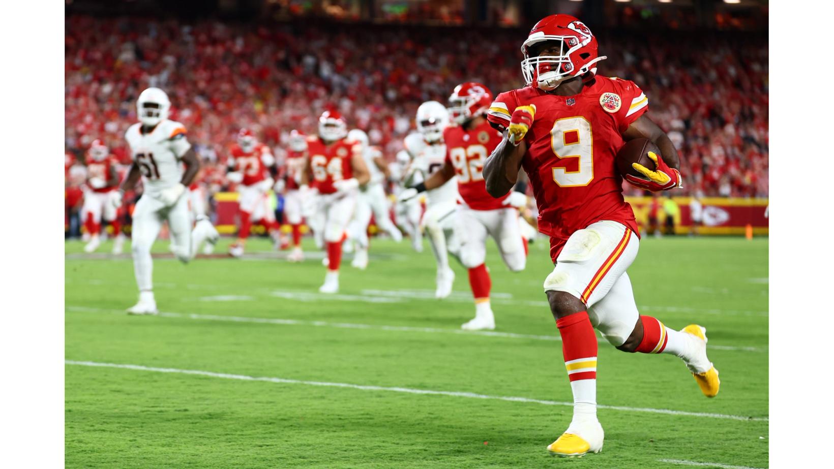 Kansas City Chiefs running back Kenneth Walker III (9) runs into open field ahead of trailing Denver Broncos defenders at Arrowhead Stadium