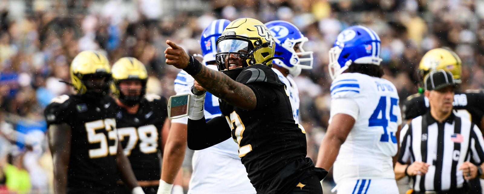 UCF quarterback Keyone Jenkins, No. 12, points downfield in front of BYU players during the Knights' 39-31 double-overtime win at Acrisure Bounce House on Oct. 24, 2026