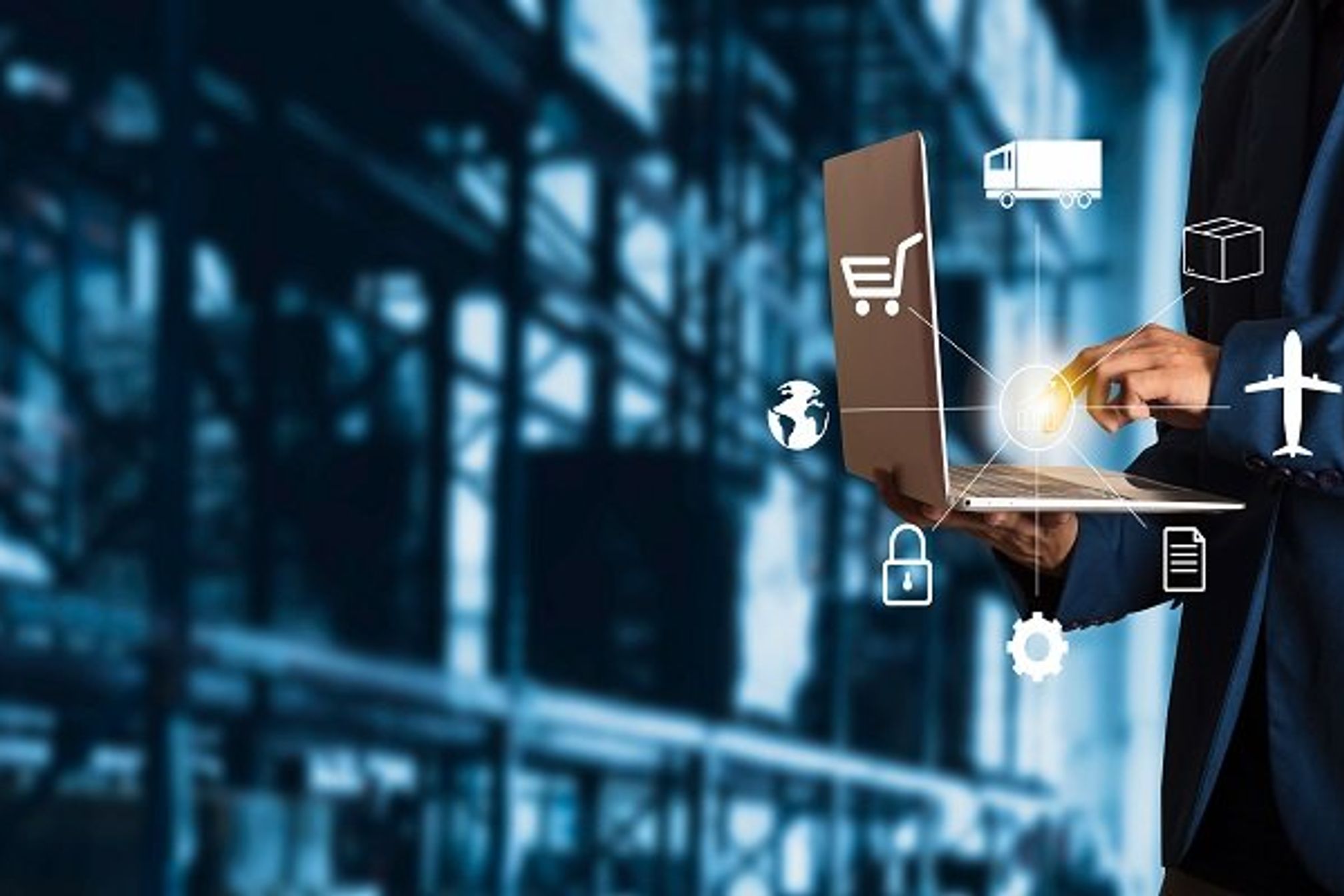 Businessman manager using laptop check orders online goods worldwide for network with Modern Trade warehouse logistics. Industry of logistics network concept.