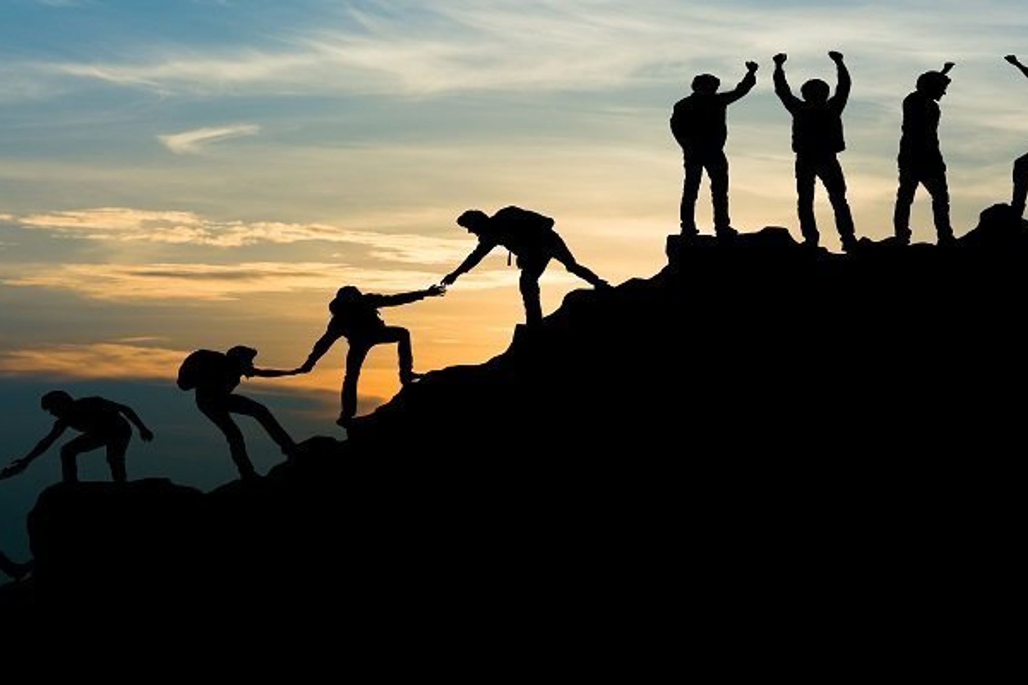 Group of people on peak mountain climbing helping team work , travel trekking success business concept