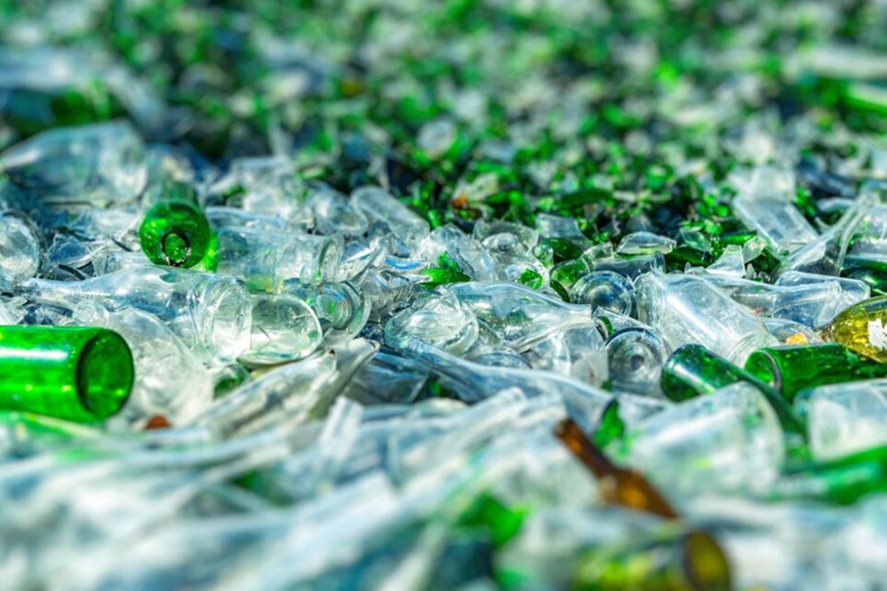 Image of broken glass bottles in a pile.