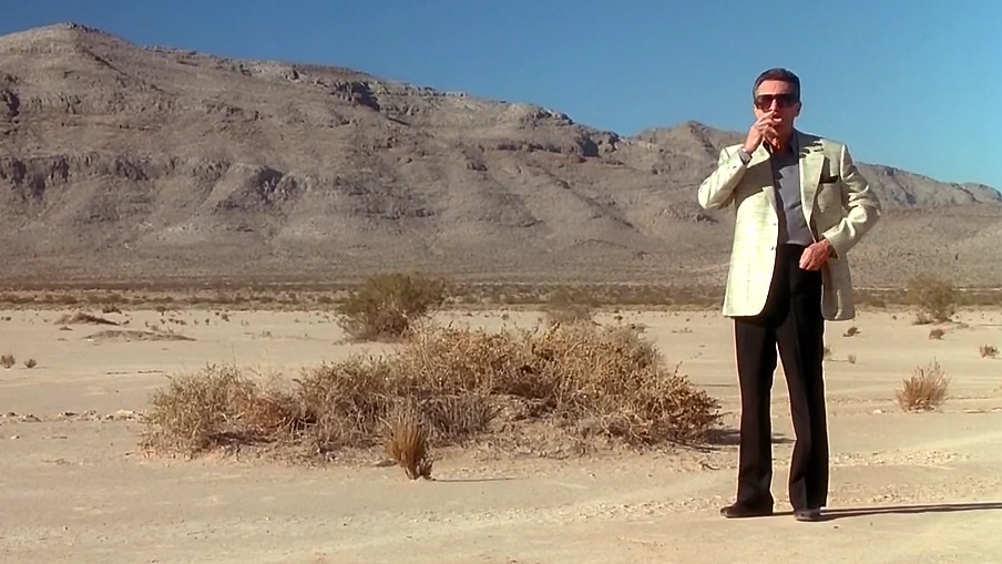 robert de niro standing a lone in the desert