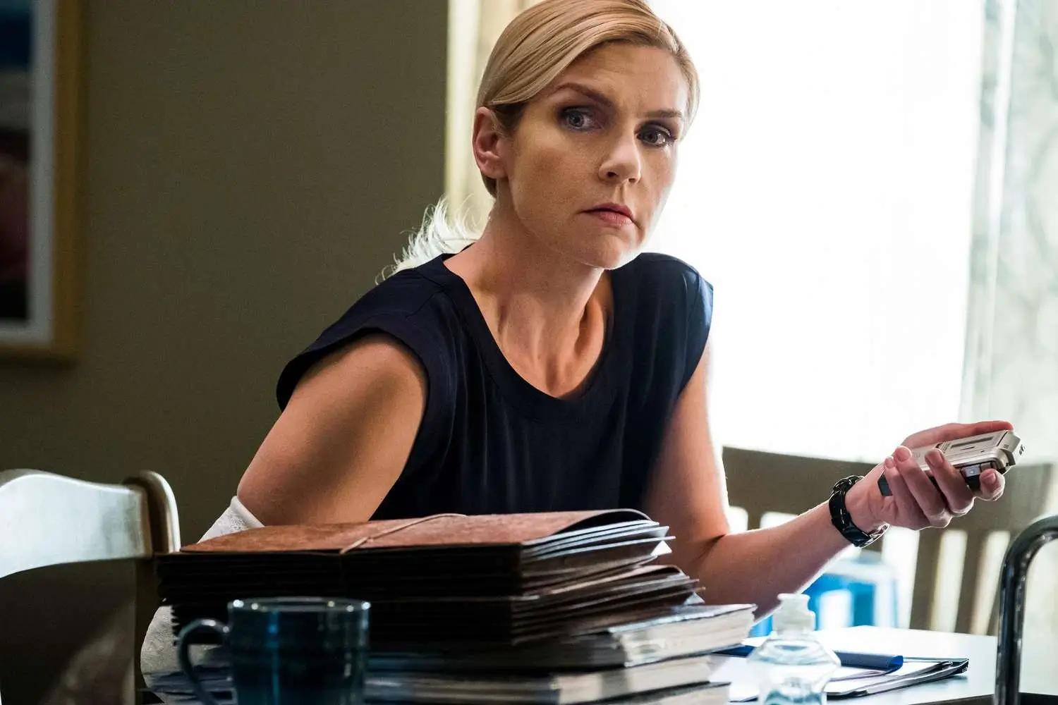Rhea Seehorn's character Kim Wexler sitting at a desk