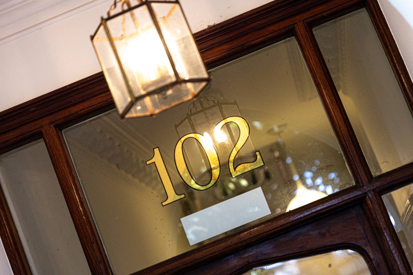 door way at pontcanna dental care showing street number in gold against transparent window