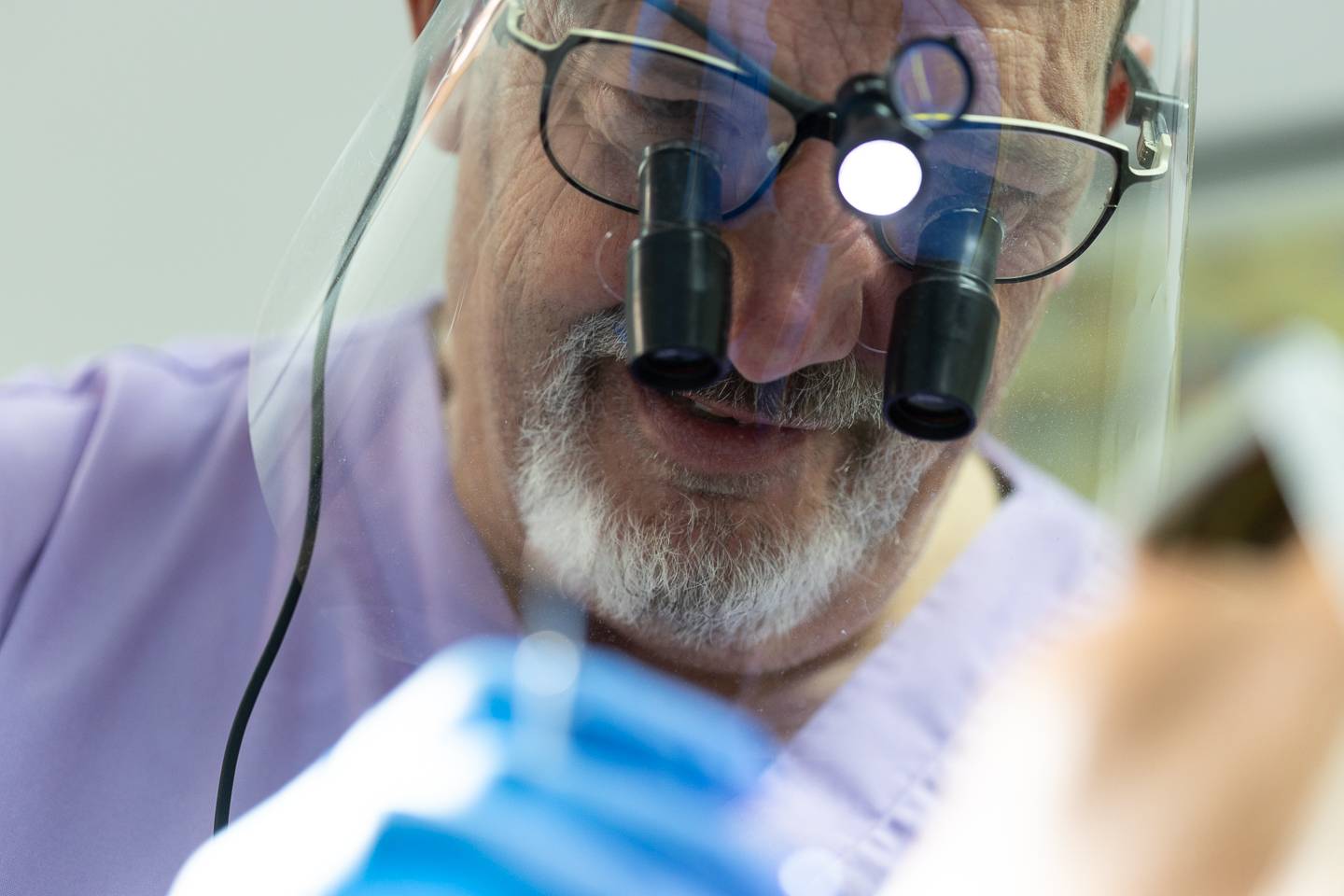 Dentist examining patient during check up