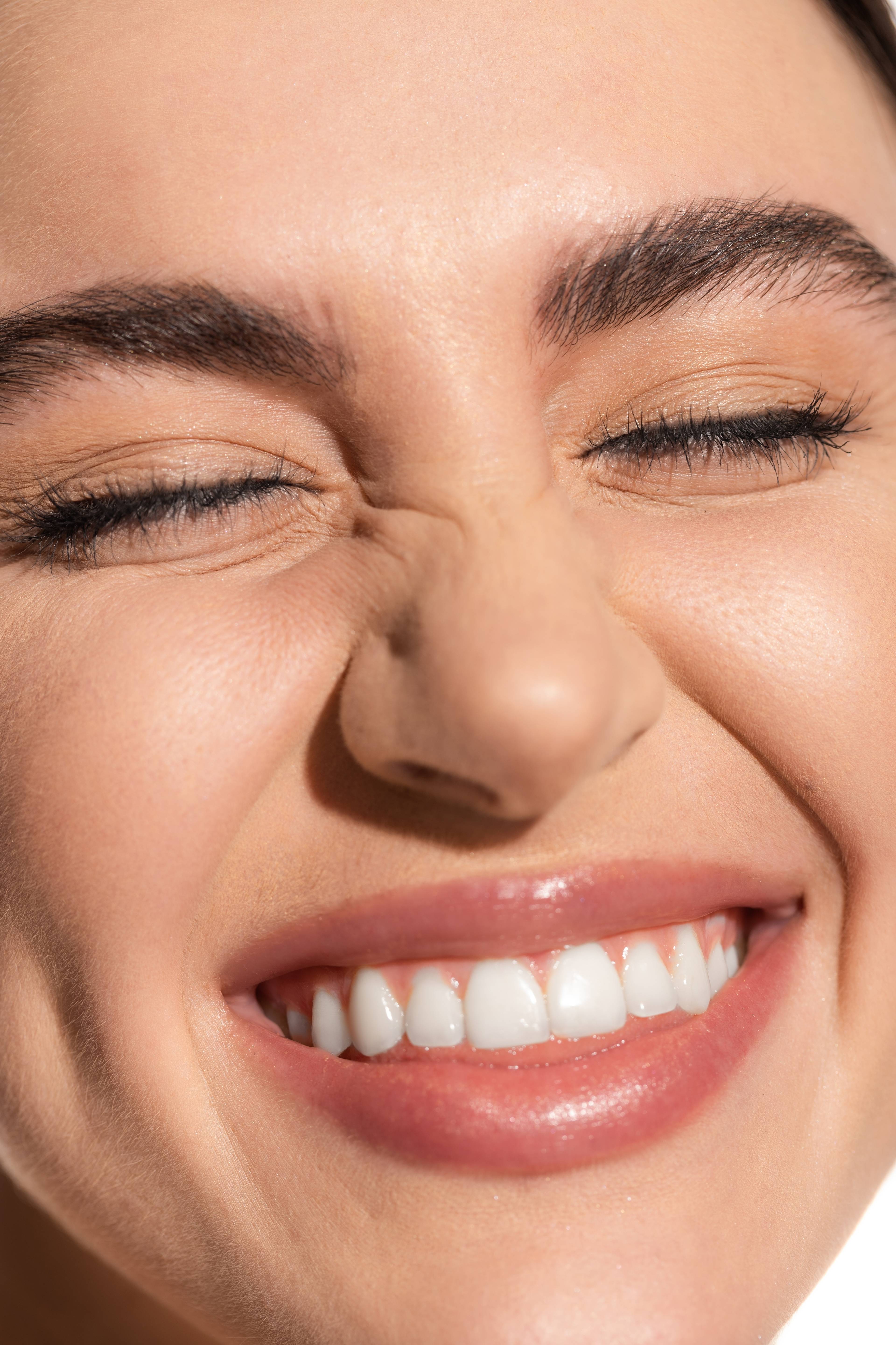 close up of young woman smiling with bright white teeth