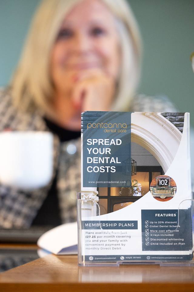 Pontcanna Dental Care flyer about spreading cost of dental treatment in a holder in front of receptionist
