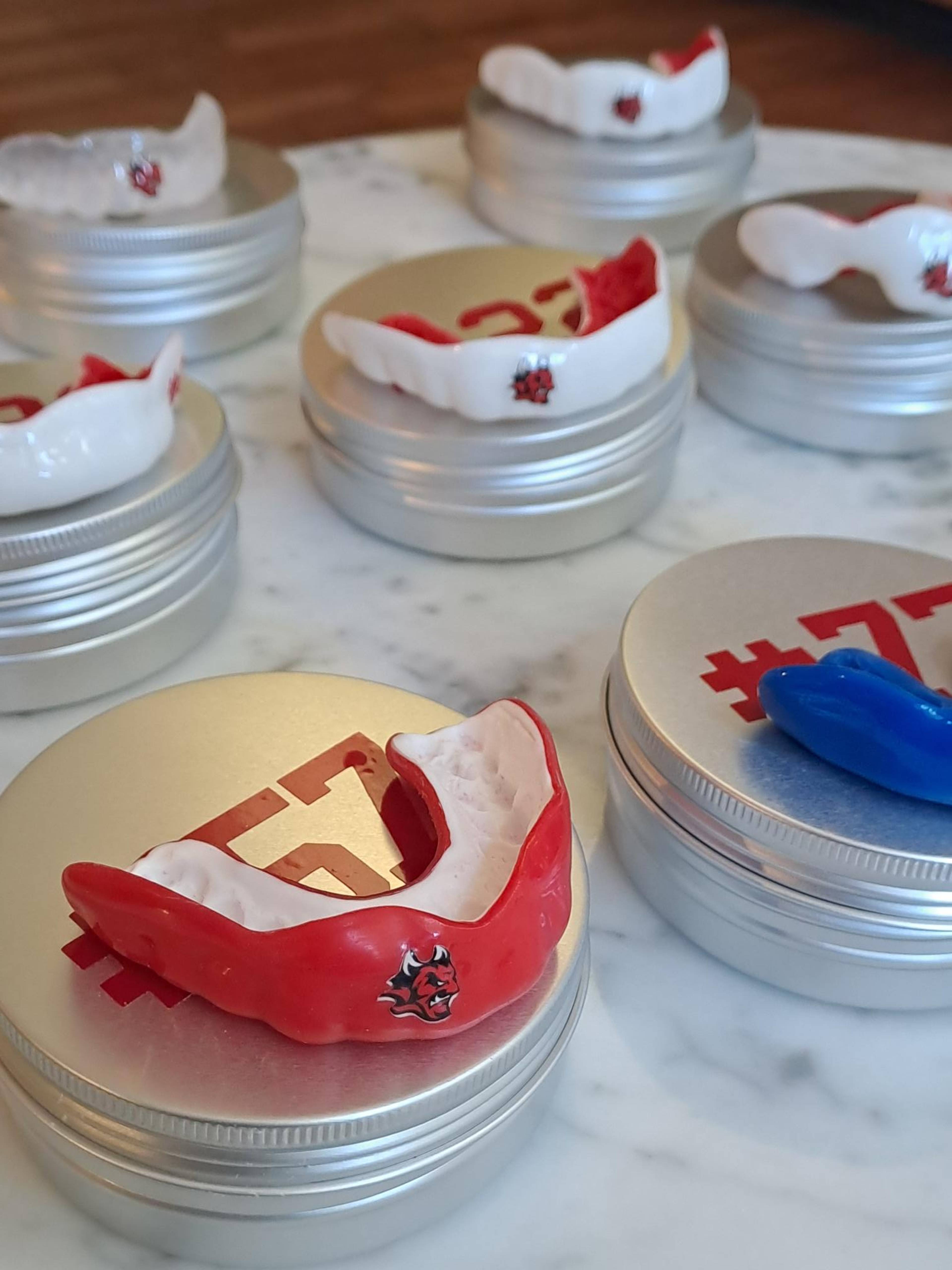 Sports mouth guards in a variety of colours made by Pontcanna Dental Care for Cardiff Devils