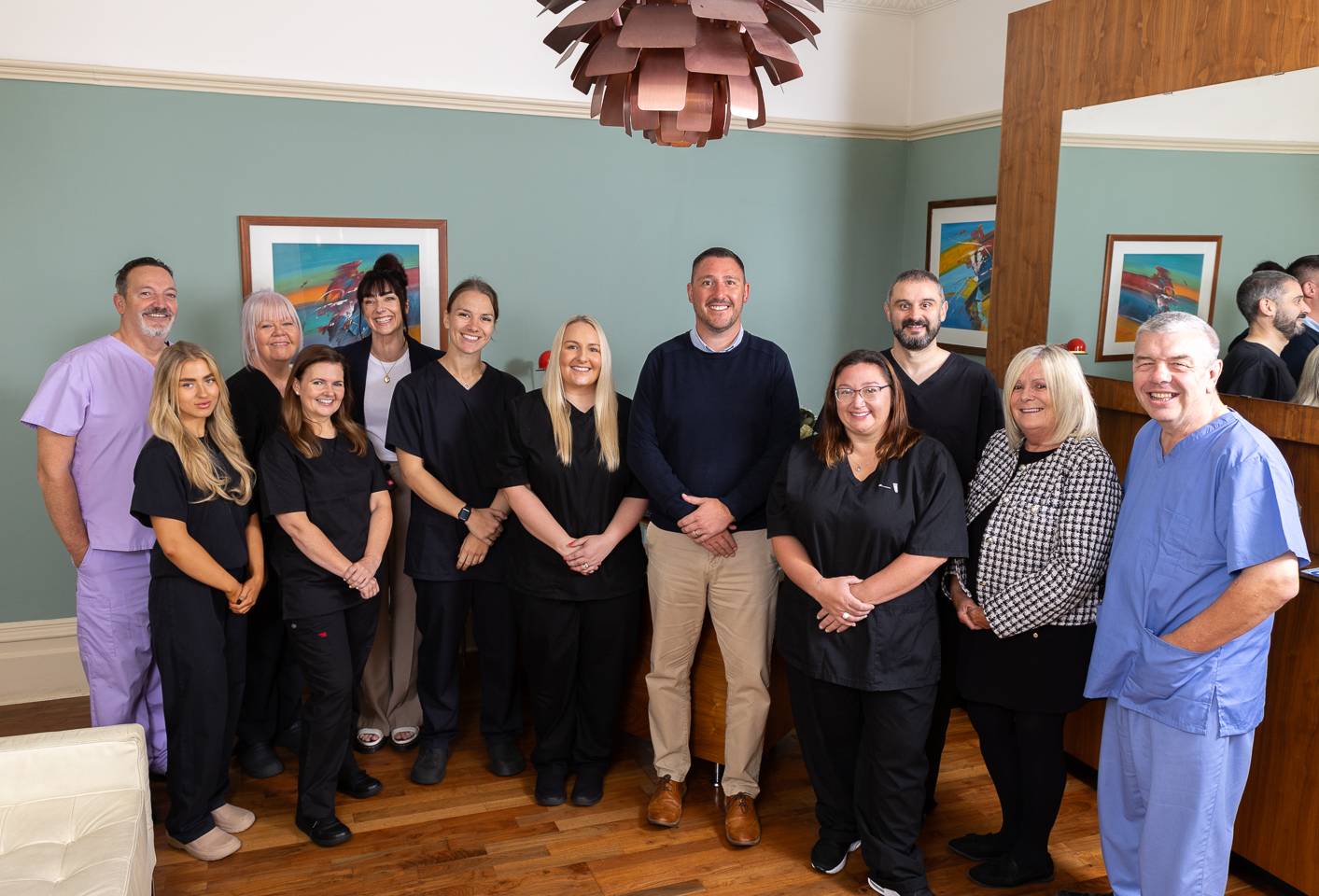 Pontcanna dental care team smiling at camera in reception