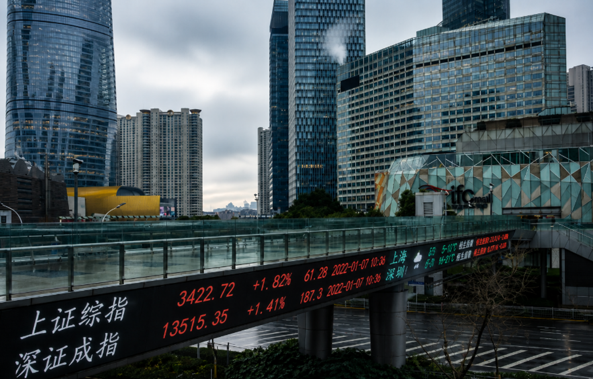 Real-time electronic stock market ticker in Shanghai's financial district showing market performance amid China's economic recovery and rising technology stocks.