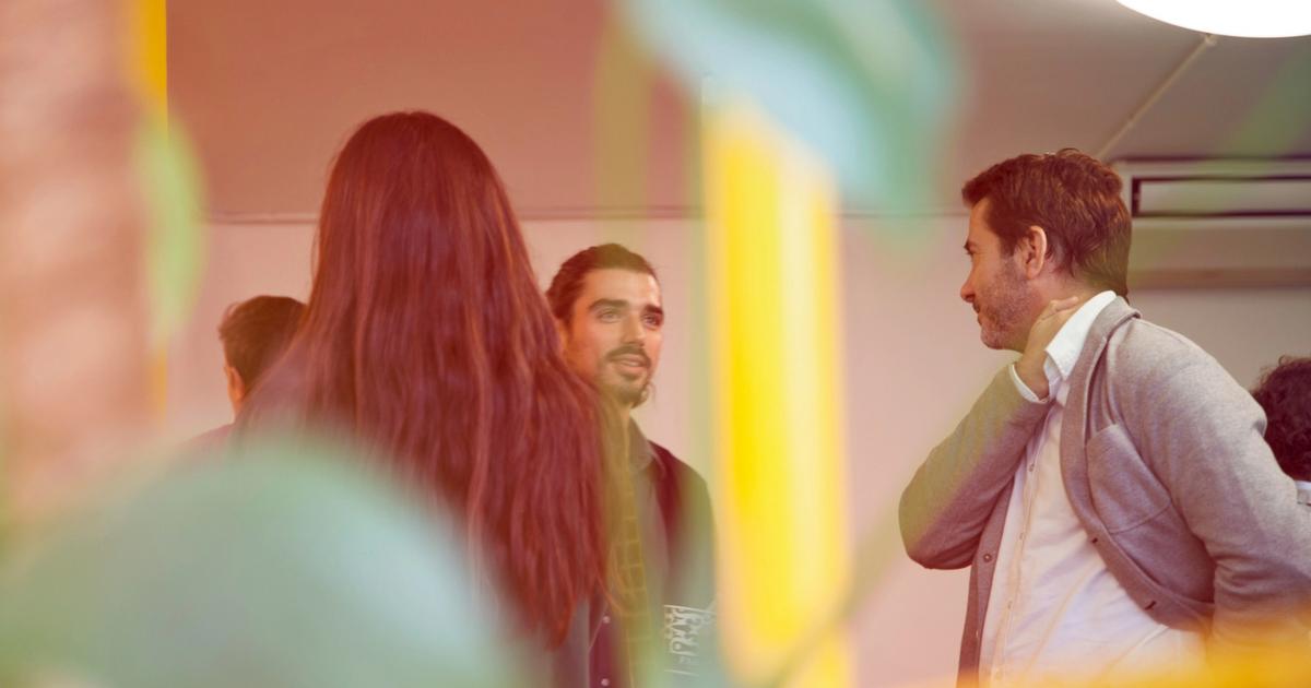 A group of people talking from a hidden perspective