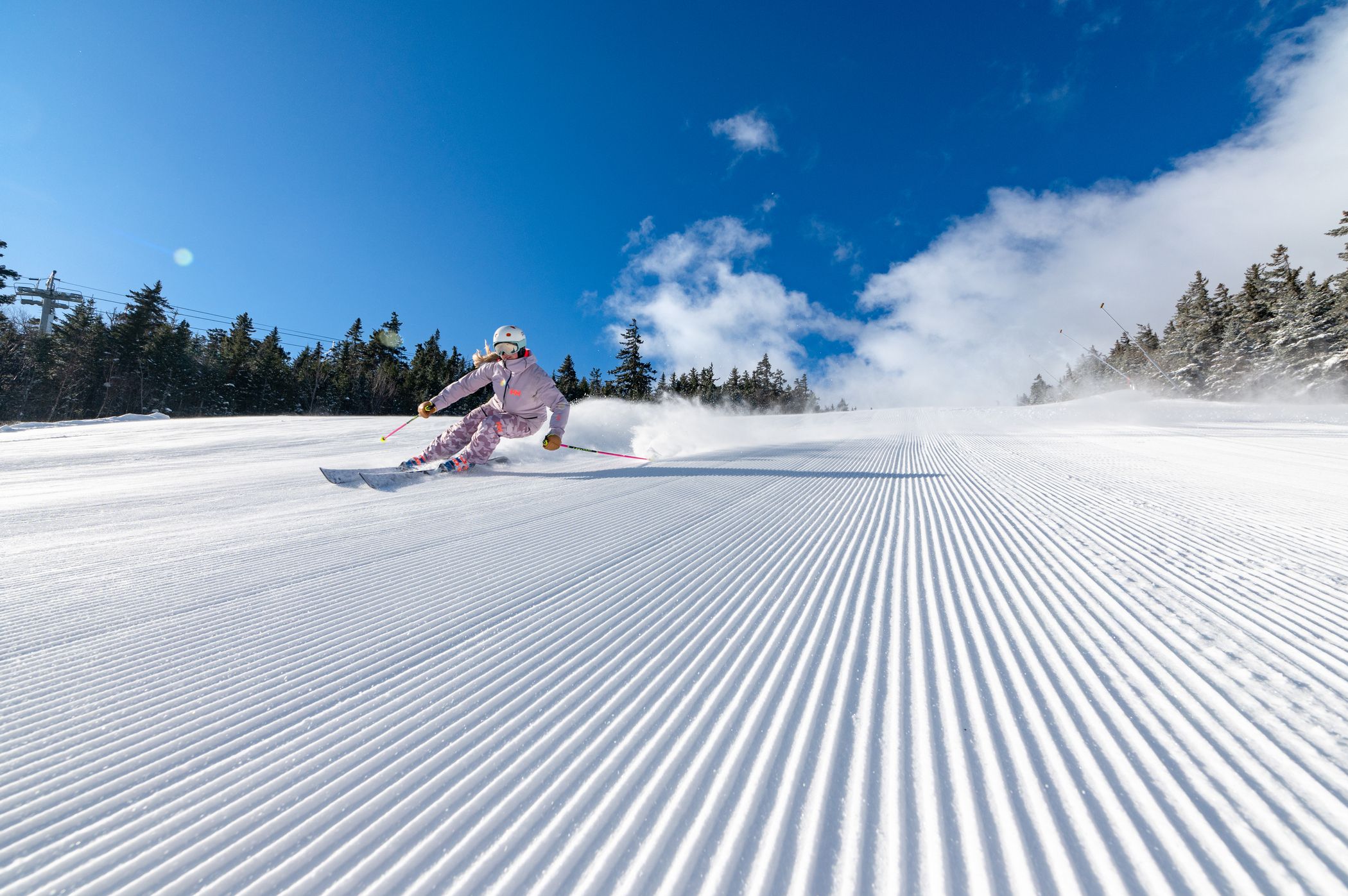 Skier on a groomed run at Sunday River