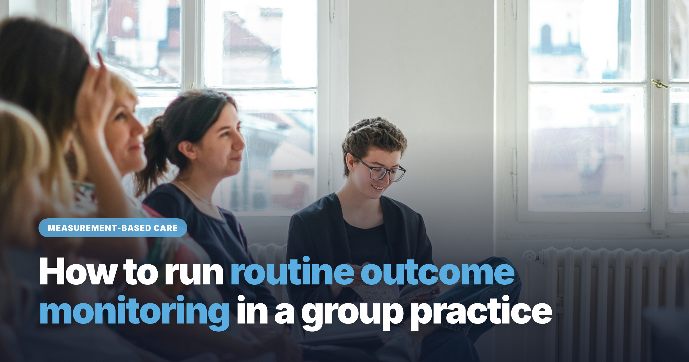 Group therapy session in a group practice, a client reviewing outcome measures as part of measurement-based care