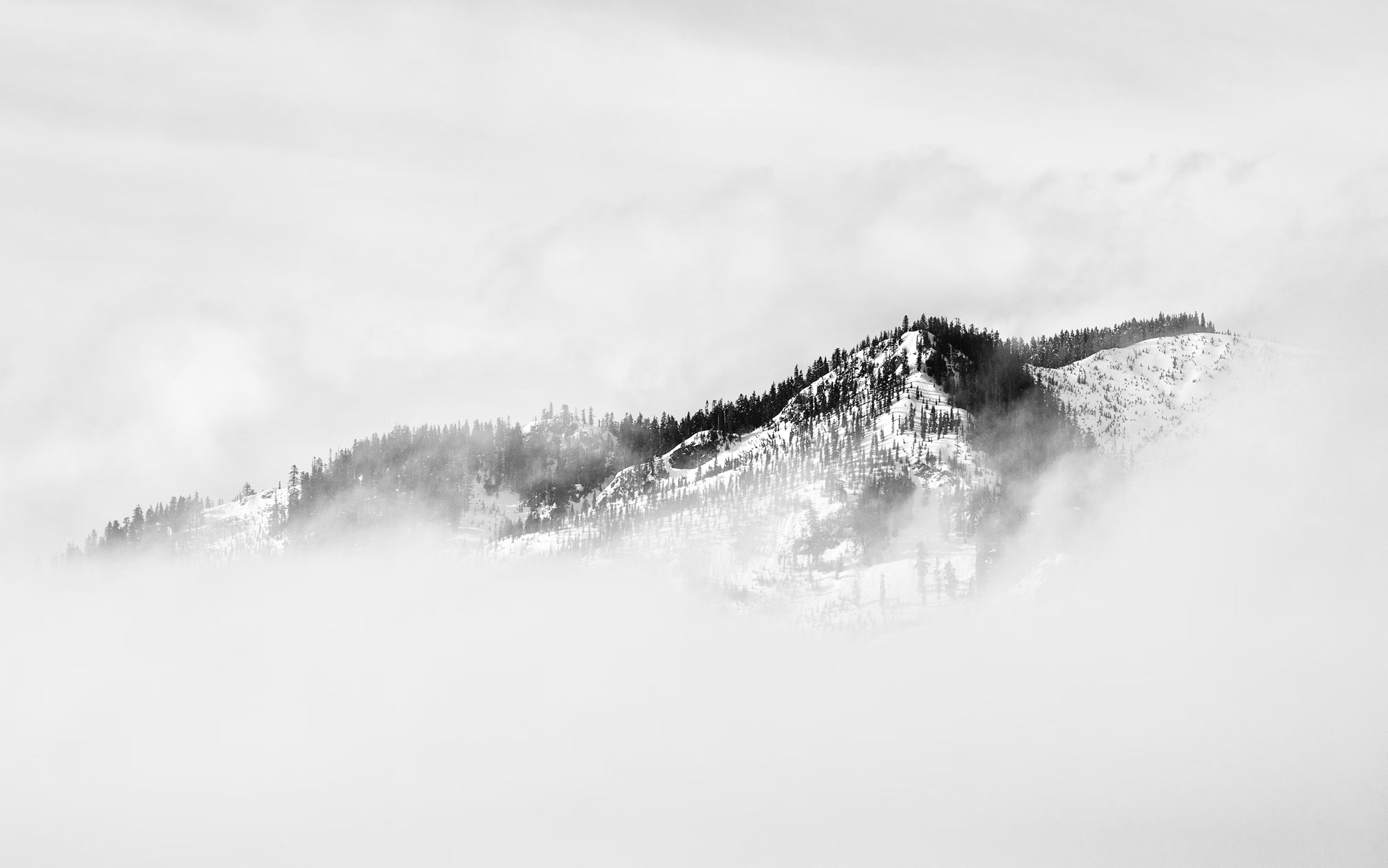 Mountains surrounded by gray clouds