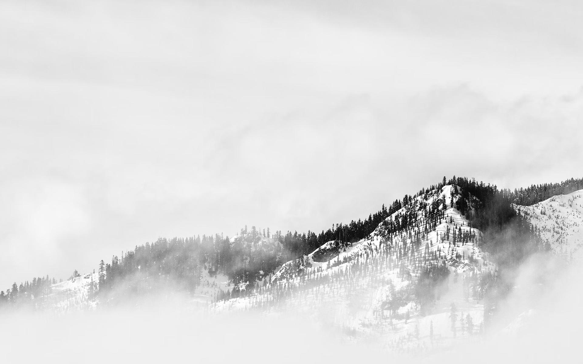 Mountains surrounded by gray clouds
