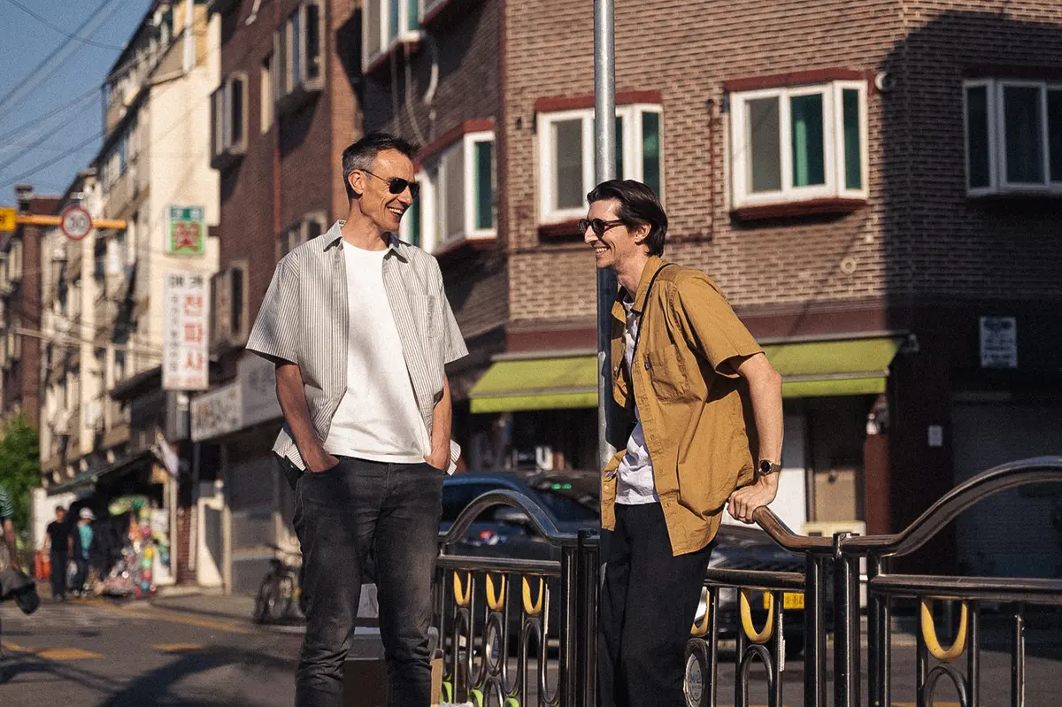 Candid street photo of Jitse and Chris making jokes, Mangwon-dong street scene