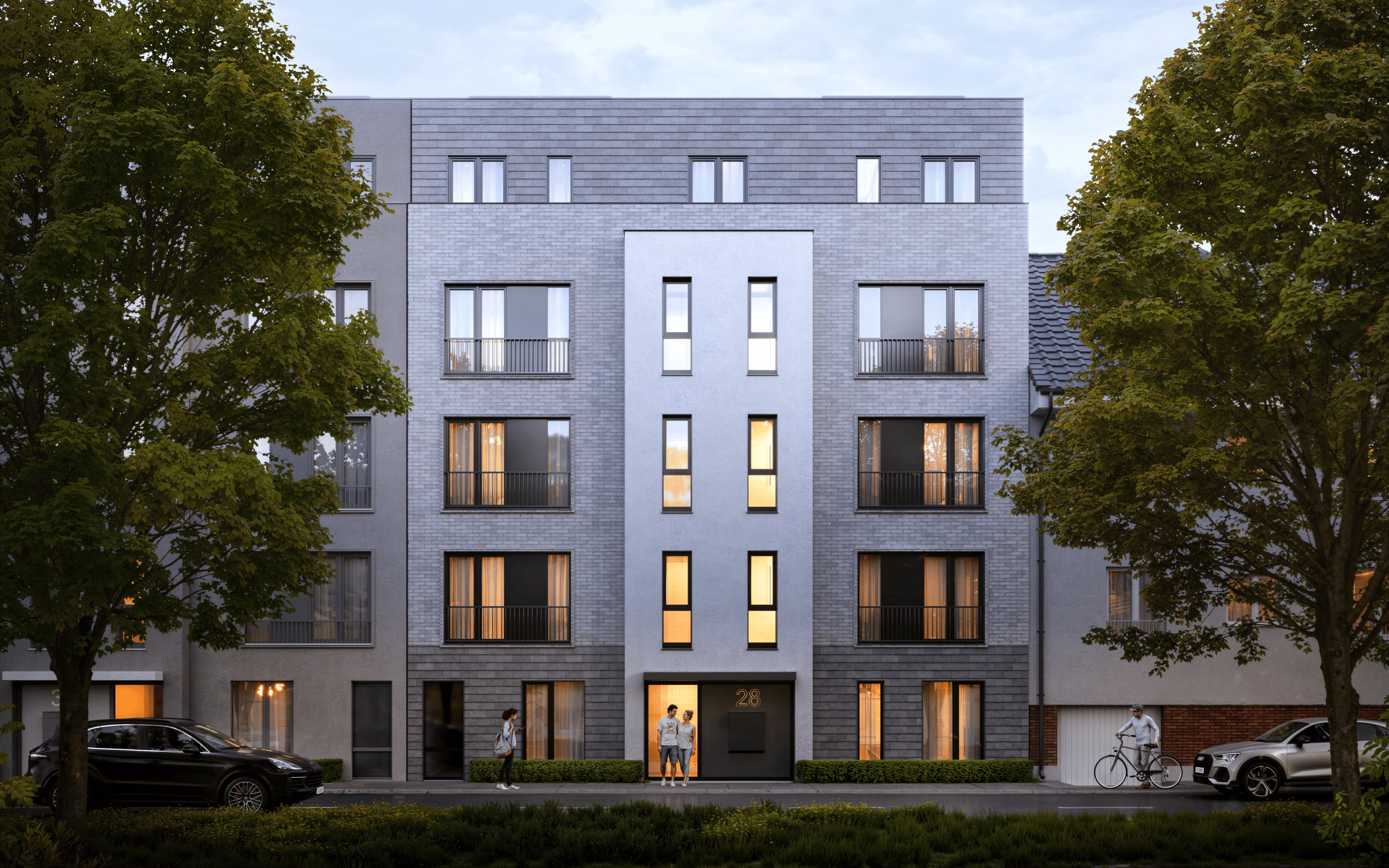 Moderne Außenansicht der Lutteroth Lofts in Eimsbüttel, Hamburg, umgeben von grünen Bäumen und einer urbanen Umgebung.