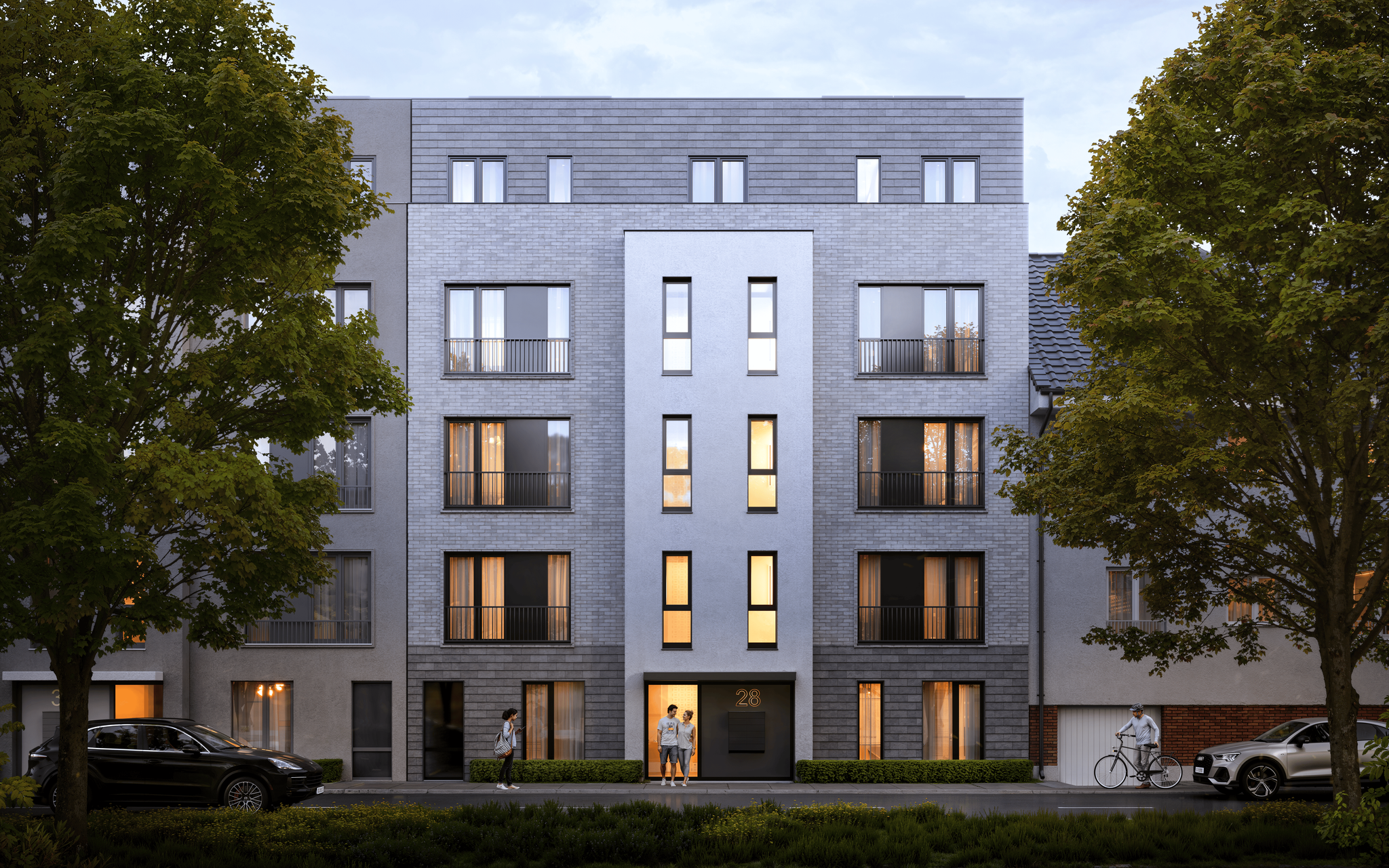 Moderne Außenansicht der Lutteroth Lofts in Eimsbüttel, Hamburg, umgeben von grünen Bäumen und einer urbanen Umgebung.