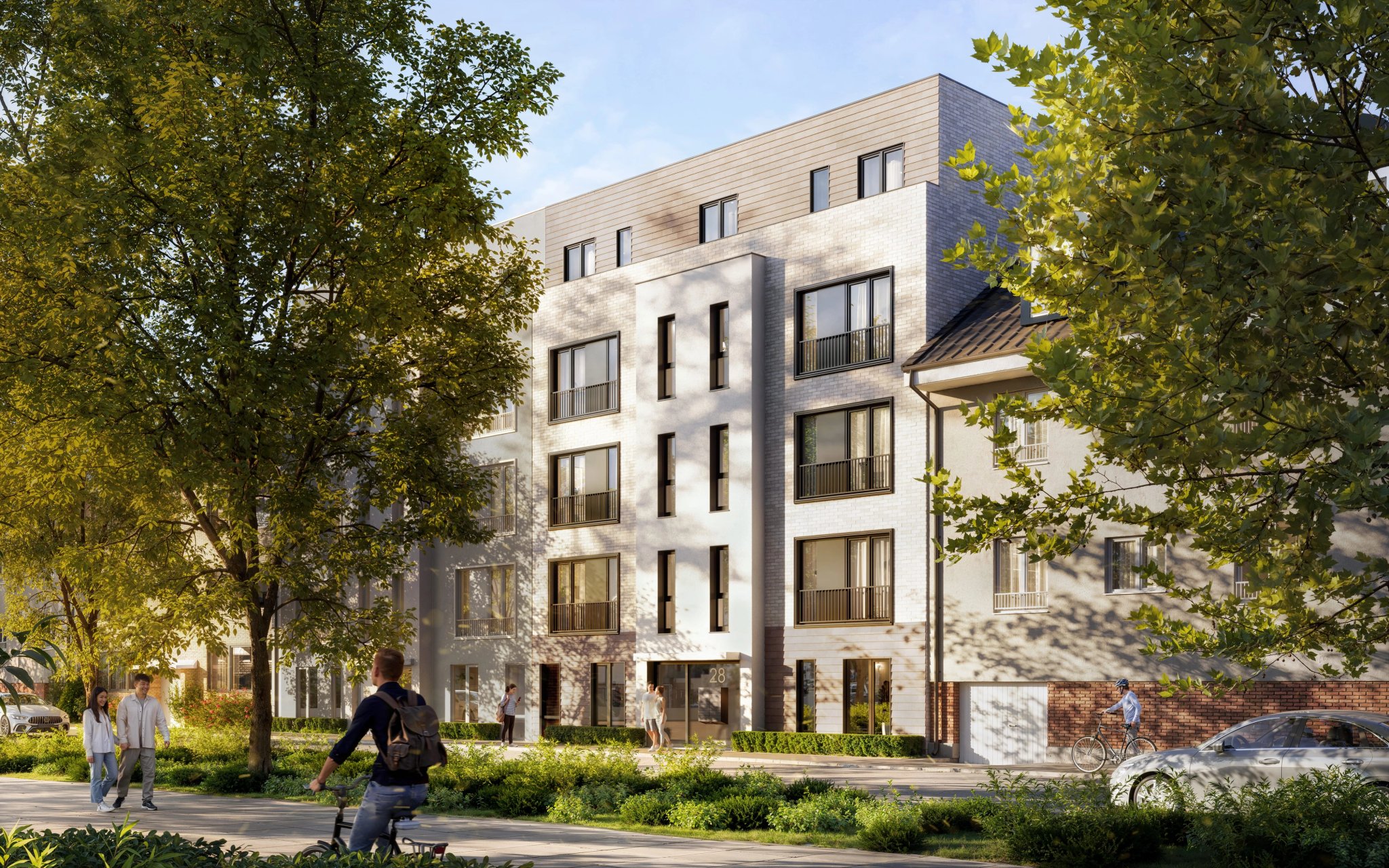 Abendansicht der Lutteroth Lofts mit beleuchteten Fenstern, die die Architektur des Gebäudes hervorheben.