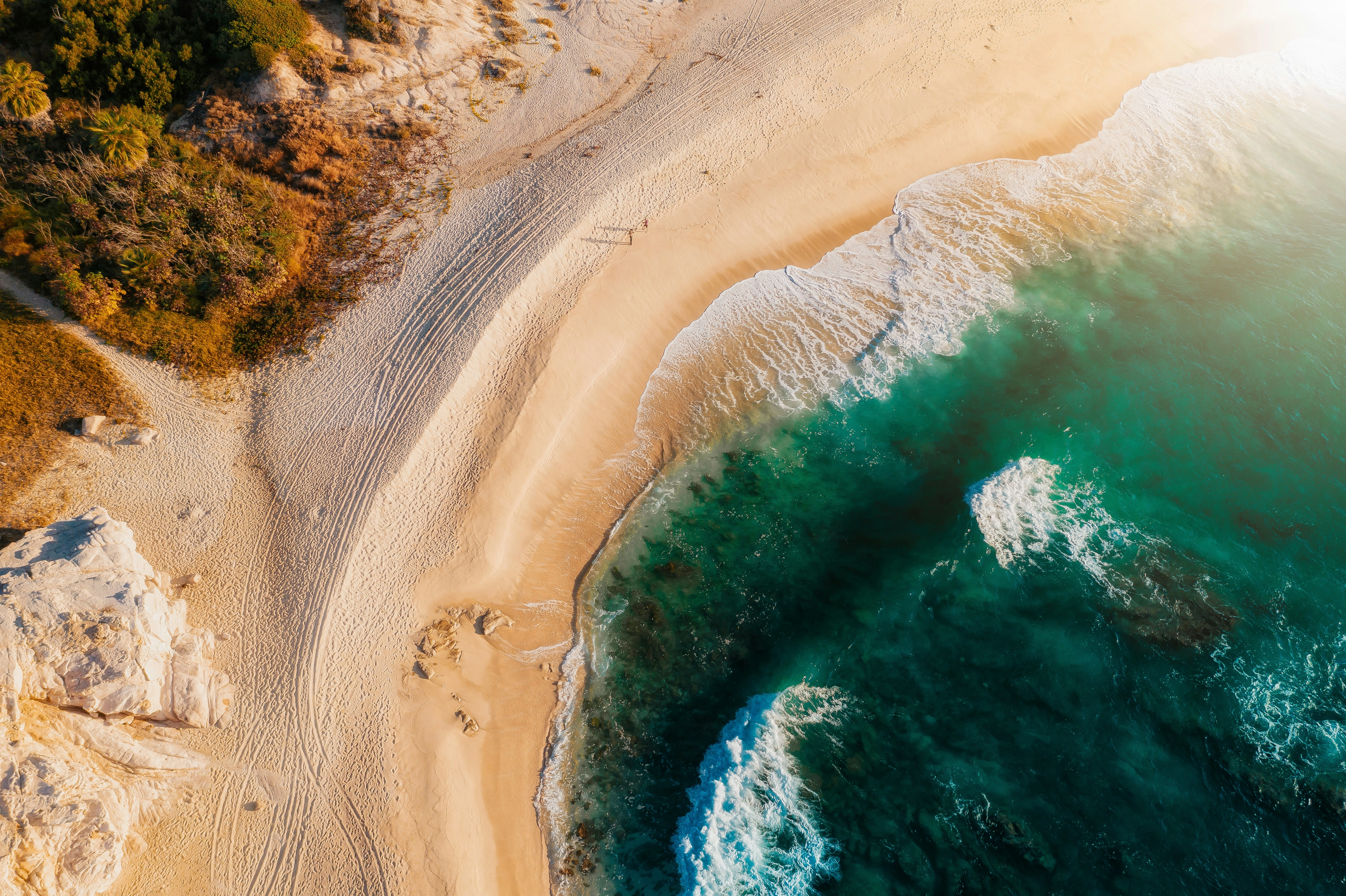 Photo by Alejandro Cabrera M. aerial-view-of-beach-during-daytime on Unsplash