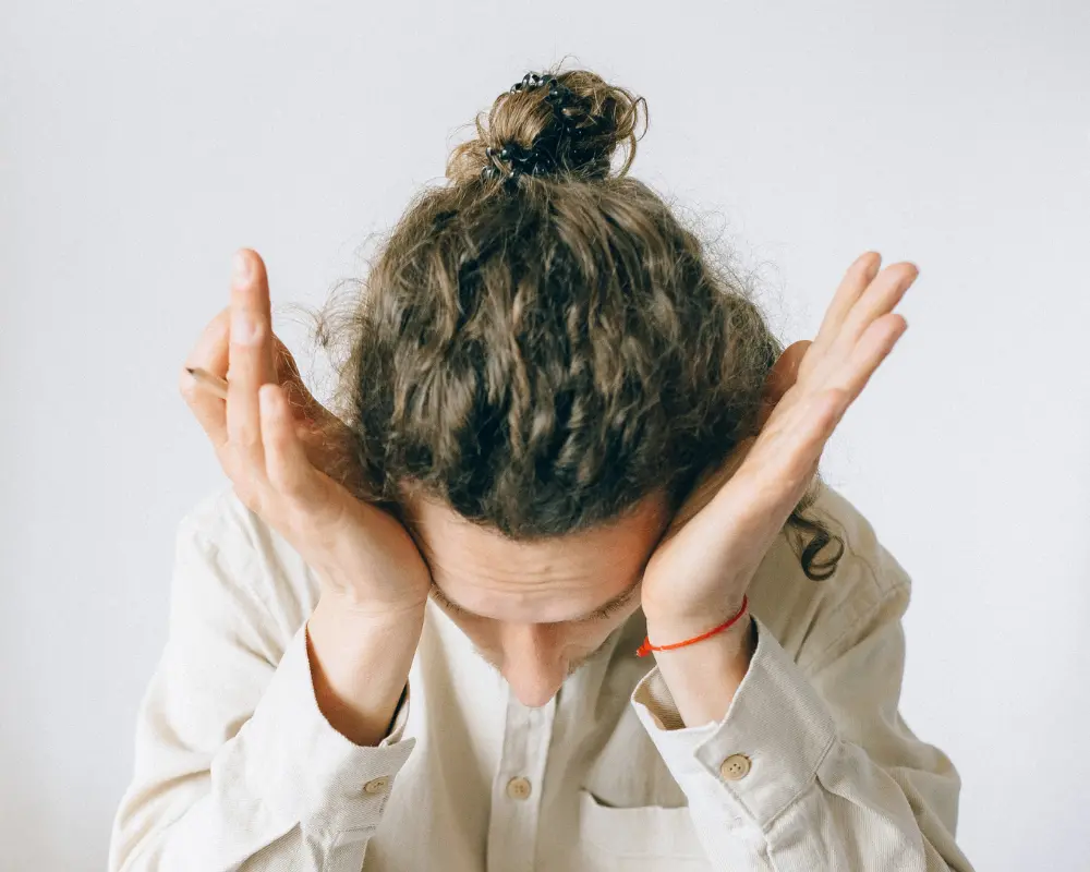 Man with his head in his hands