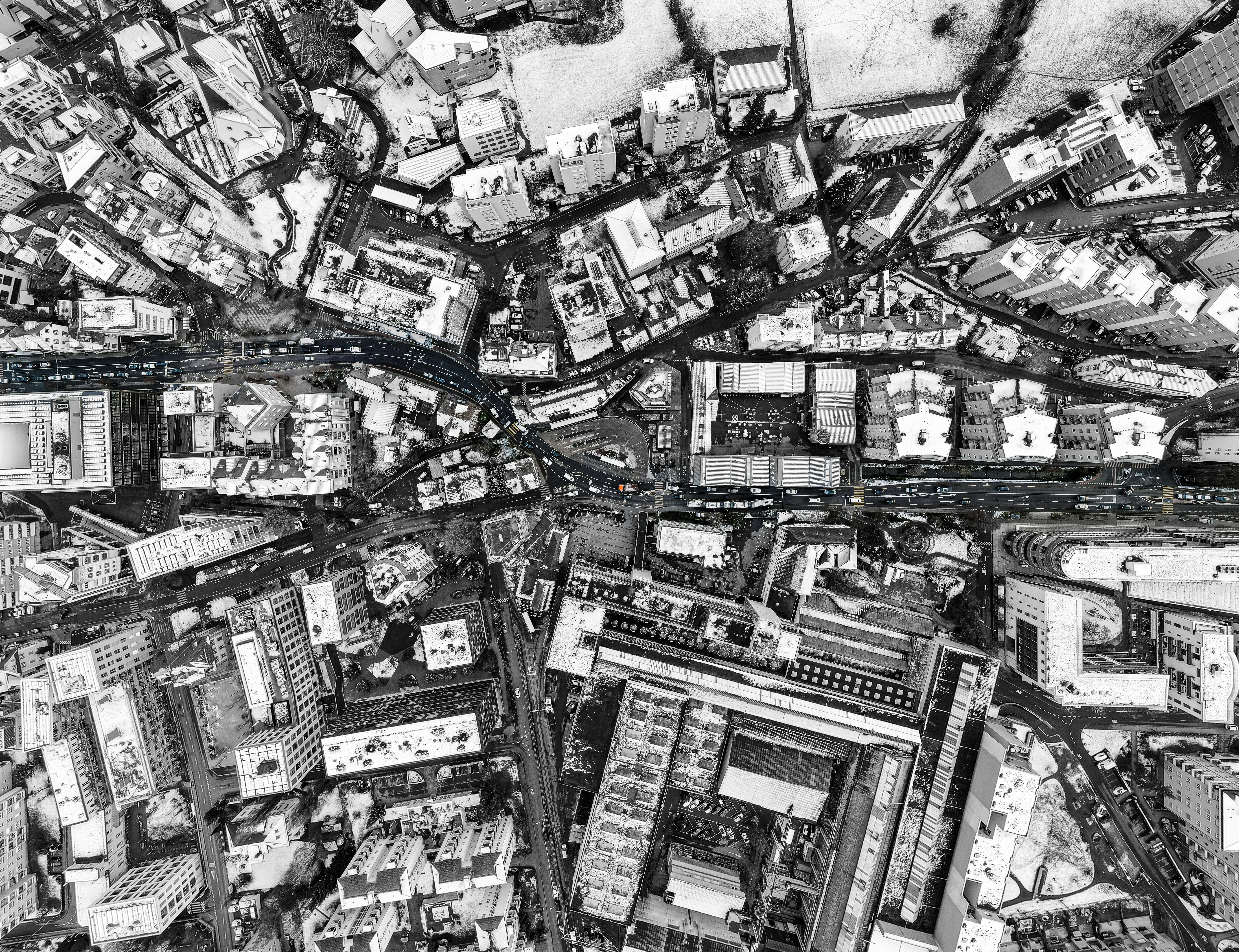 Photo by Simon Infanger: a black-and-white aerial photo of a city, on Unsplash
