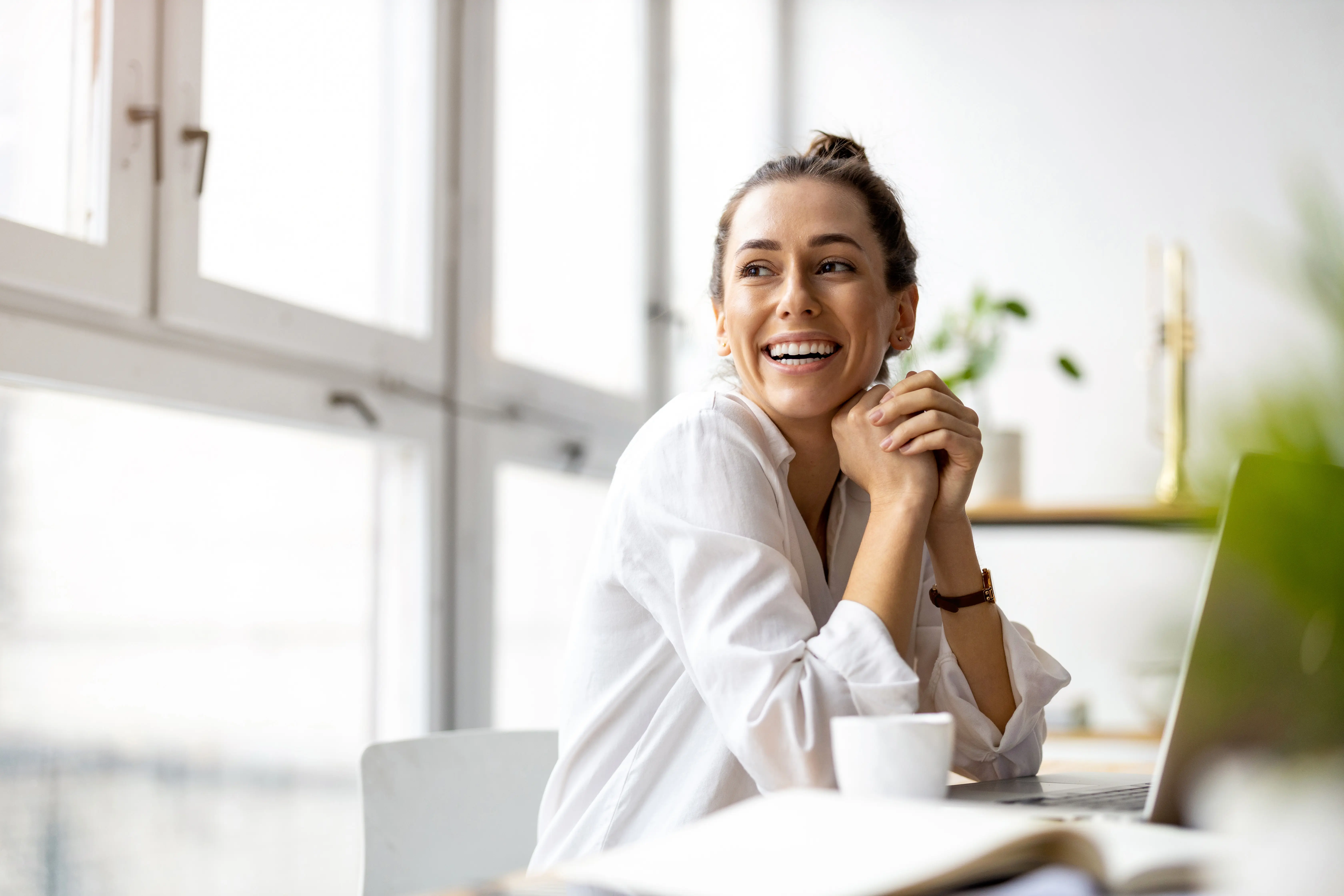 Woman smiling with laptop